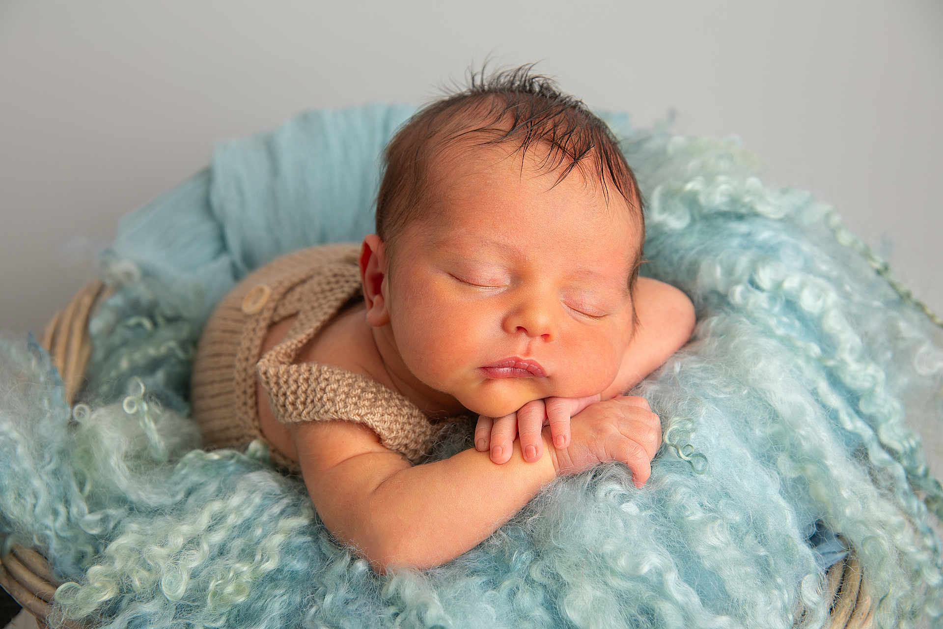Oliver joined the competition — help win amazing prizes! newborn, baby, sleeping, basket, knitted_outfit, blue_fabric, curly_texture, soft, cozy, peaceful, portrait, infant, resting, cute, hands, face, skin, head, closed_eyes, indoors