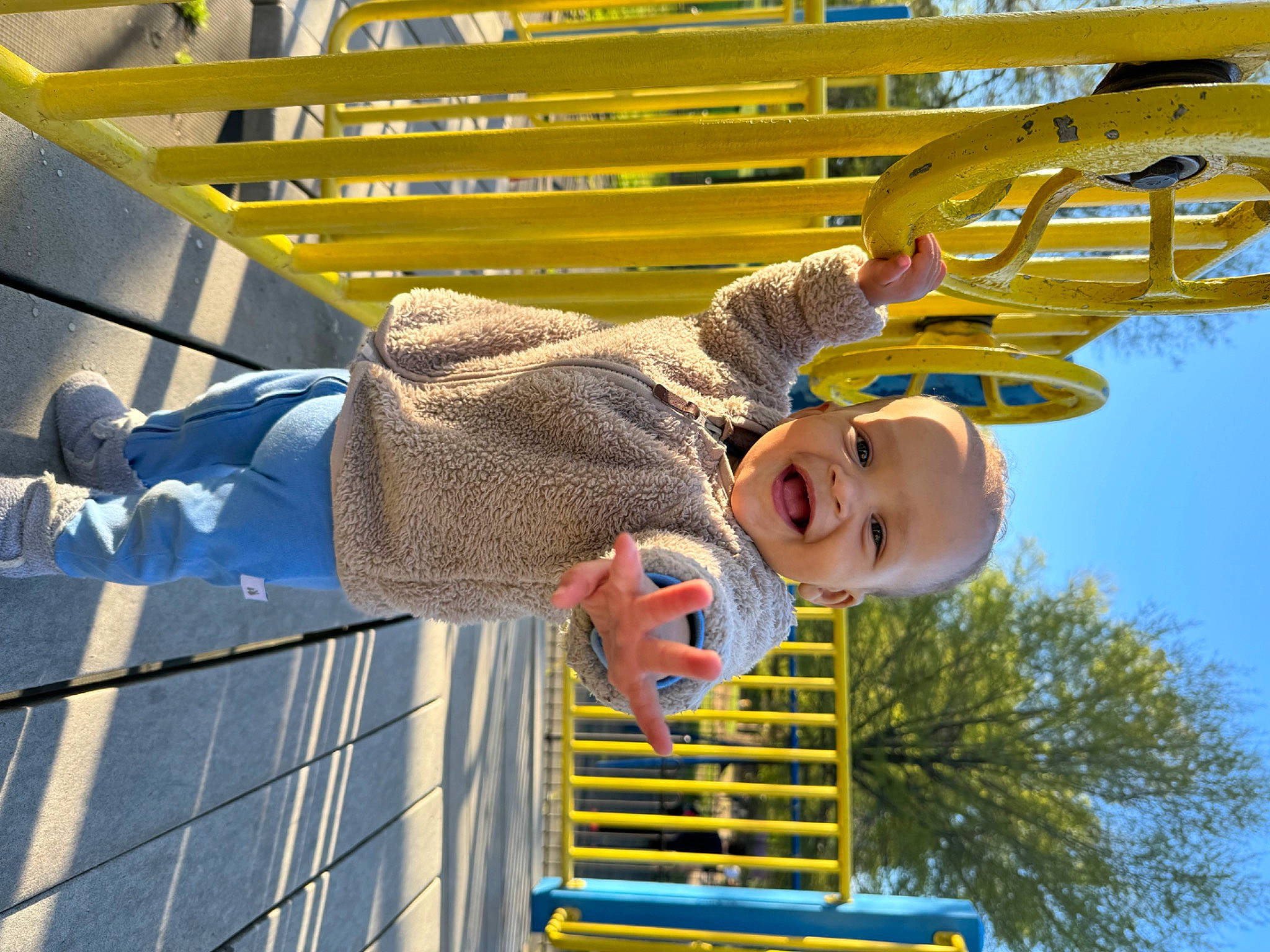 Kel is registered to the contest to win money with this photo: baby, baby_toddler_clothing, electric_blue, engineering, fun, happy, hat, leisure, pattern, person, recreation, sky, smile, toddler, tree, yellow