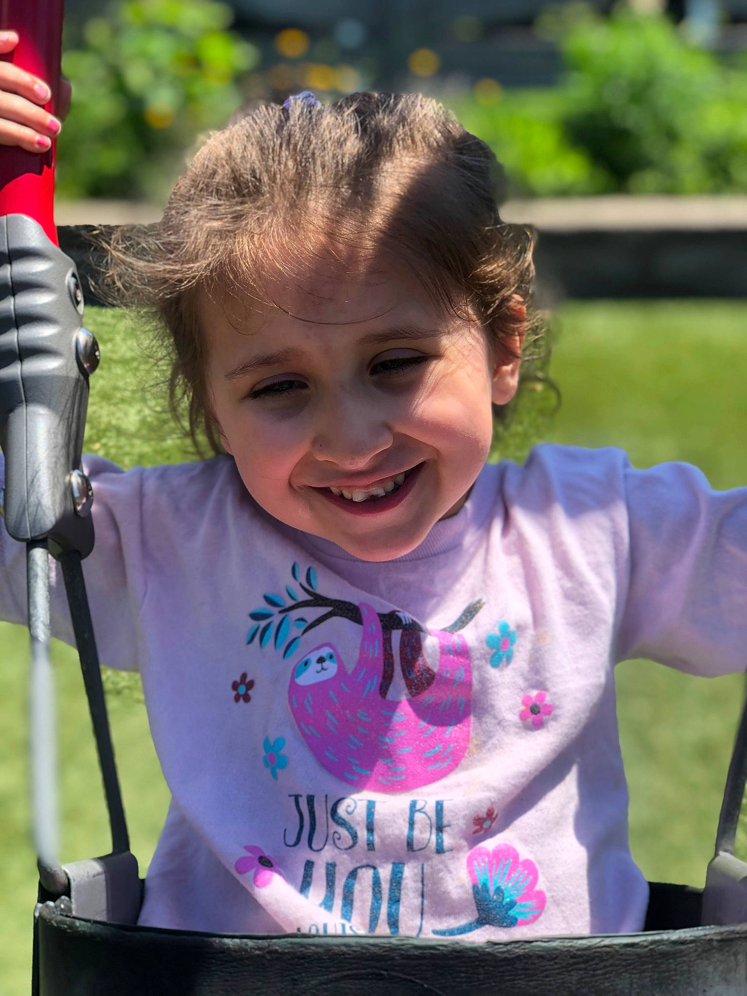 Kameron is registered to the contest to win money with this photo: audio_equipment, child, event, eye, facial_expression, fun, grass, happy, iris, joy, laugh, leisure, magenta, outdoor_play_equipment, person, pink, recreation, smile, spring, summer