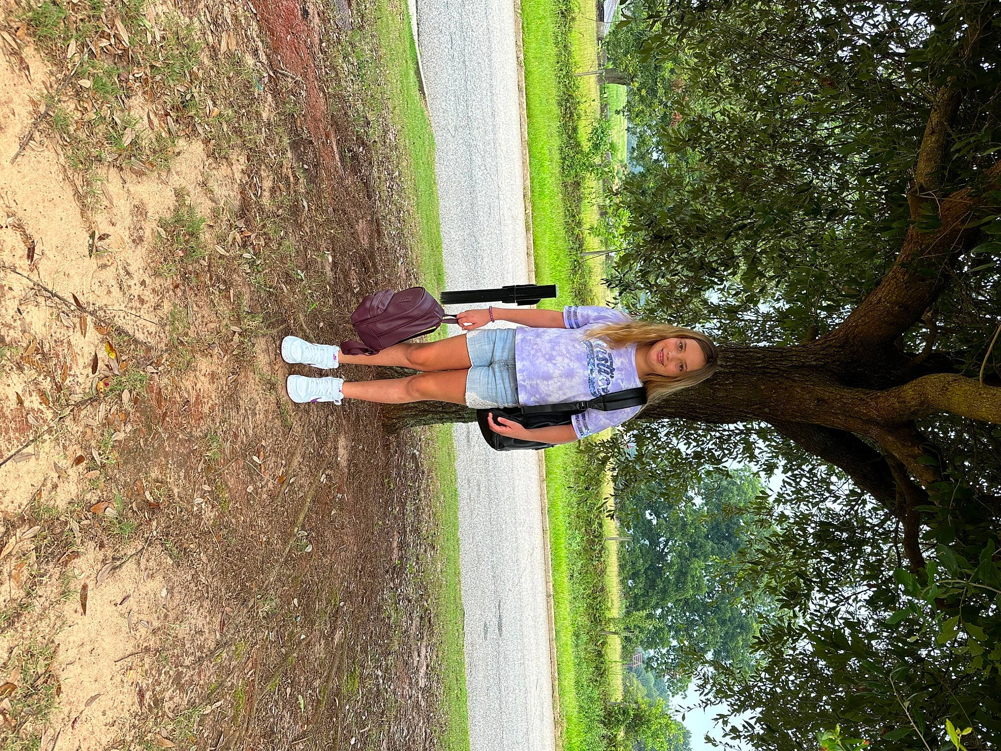 Paizlee is registered to the contest to win money with this photo: elbow, fun, grass, happy, joy, landscape, leisure, people_in_nature, person, plant, recreation, tree, trunk, walking_shoe, wood