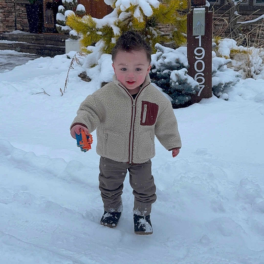 Mason joined the competition — help win amazing prizes! boy, child, clothing, coat, face, fir, glove, head, ice, jacket, male, nature, outdoors, pants, person, photography, plant, portrait, tree, vegetation