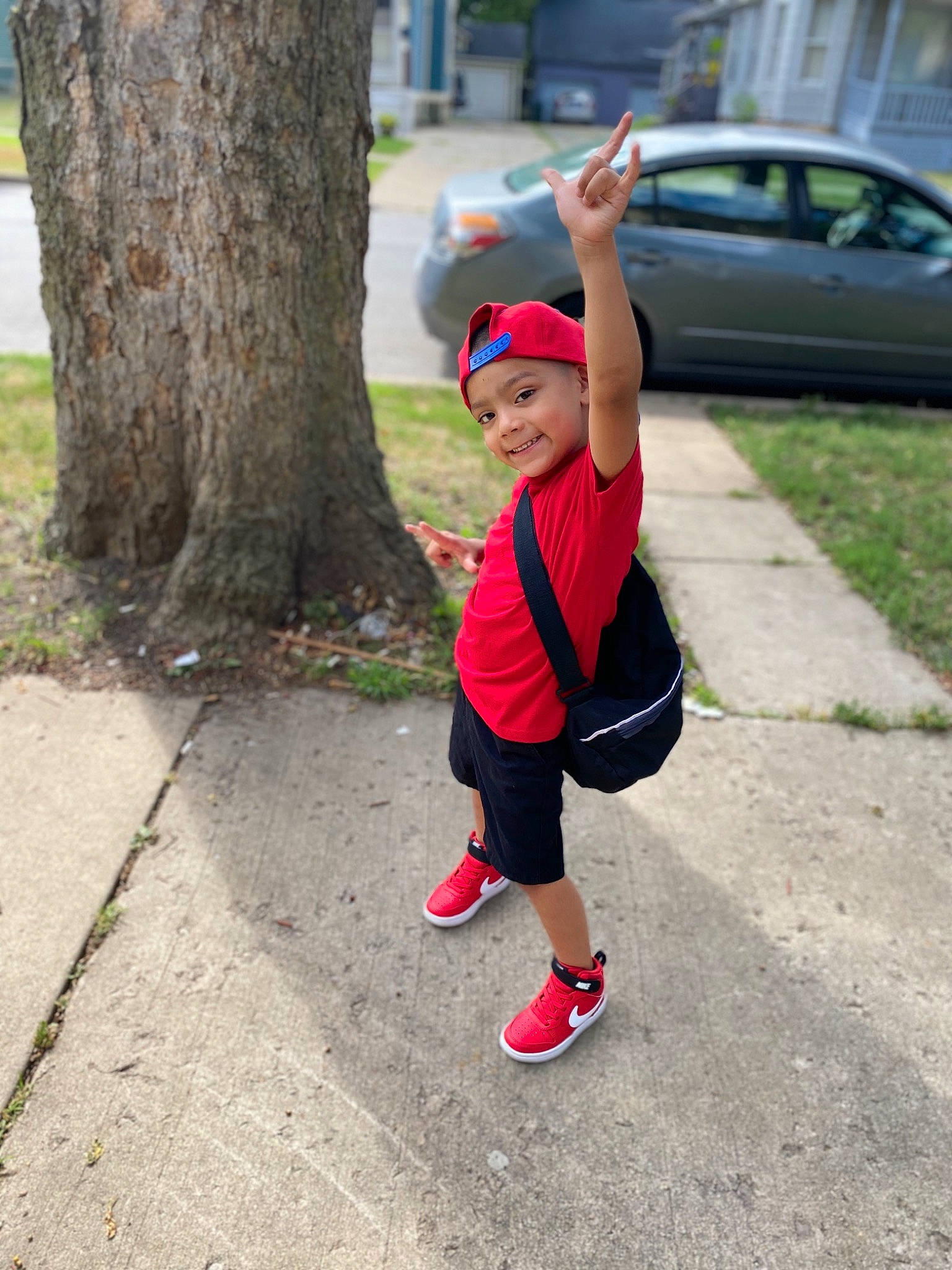 Daniel joined the competition — help win amazing prizes! asphalt, car, electric_blue, family_car, grass, hat, headwear, joy, land_vehicle, leisure, person, plant, recreation, road, shorts, sidewalk, t_shirt, tire, toddler, tree