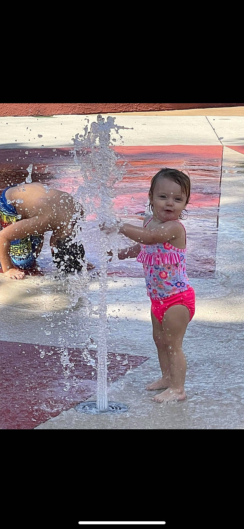 Bridget joined the competition — help win amazing prizes! barefoot, bathing, child, facial_expression, foot, fun, happy, human, human_leg, leisure, morning, people_in_nature, people_on_beach, person, play, product, recreation, standing, swimming_pool, toddler