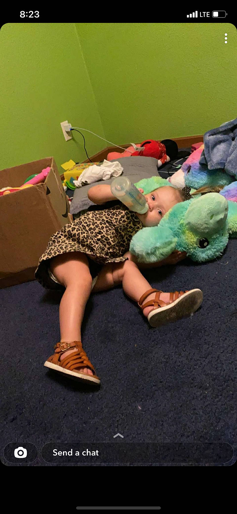 Bridget joined the competition — help win amazing prizes! barefoot, boot, calf, child, costume, entertainment, flooring, foot, fun, high_heels, human_leg, joint, knee, leisure, person, sandal, shipping_box, sitting, sneakers, sock