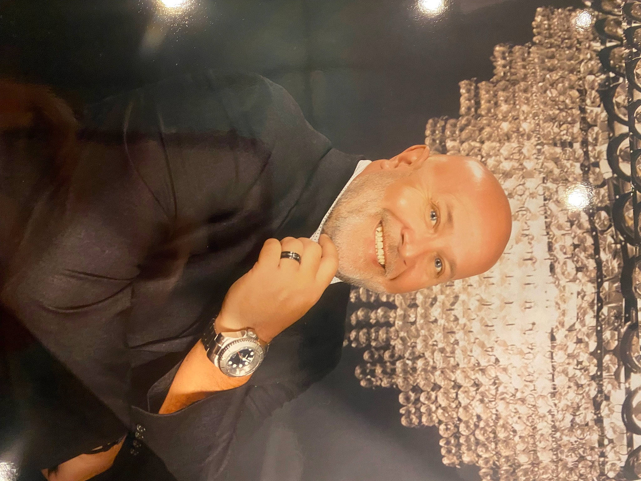 Kora is registered to the contest to win money with this photo: bracelet, clock, elbow, entertainment, event, fashion_accessory, flash_photography, fun, gesture, happy, jewellery, joy, leisure, light_fixture, person, portrait_photography, smile, thumb, watch, wrist