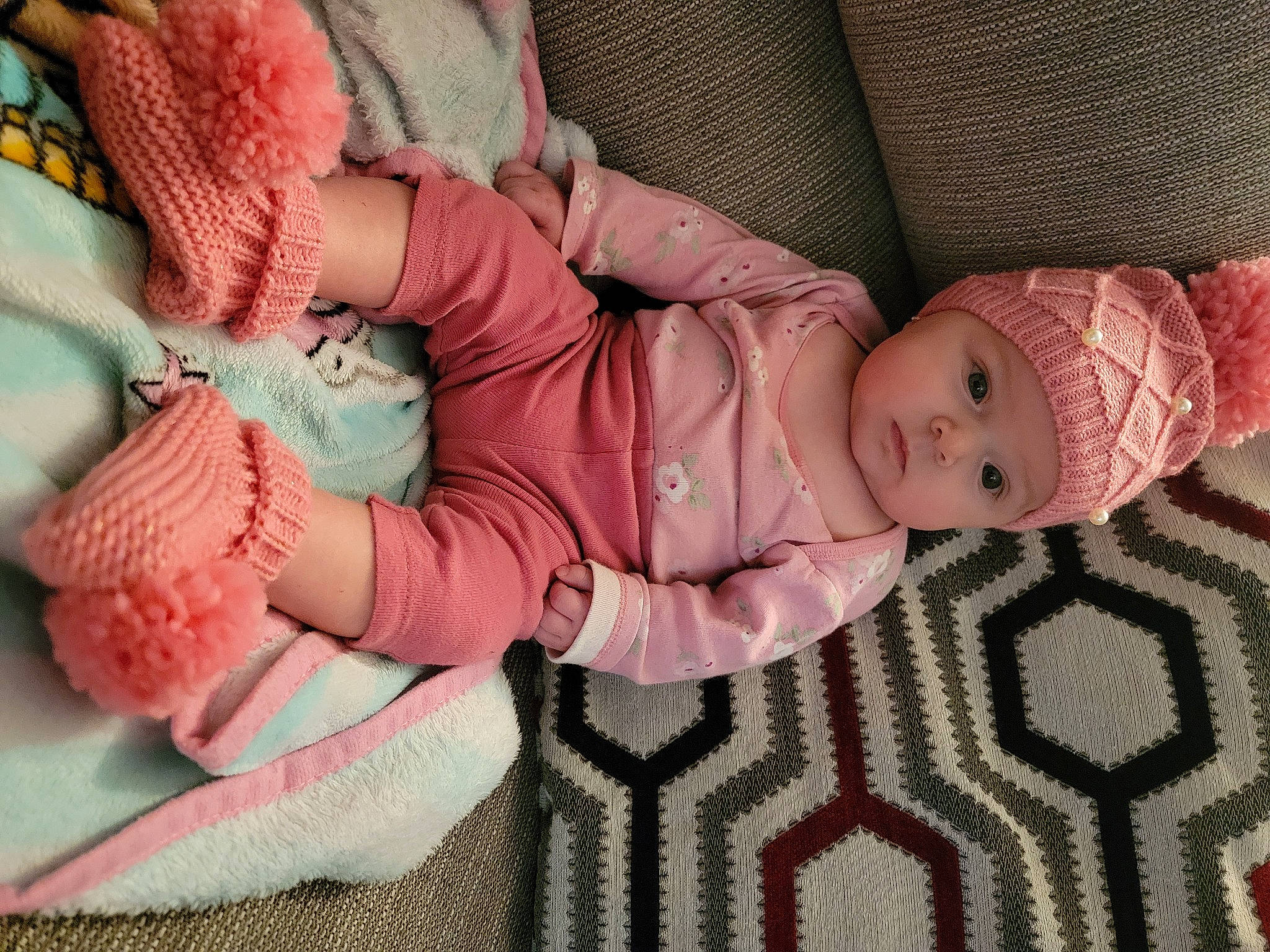 Kilynn joined the competition — help win amazing prizes! baby, baby_toddler_clothing, cheek, comfort, eye, face, finger, hand, head, headgear, headwear, human_body, linens, pattern, person, pink, skin, sleeve, textile, toddler