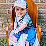 baby, child, smile, happy, cap, hat, blue_jeans, grey_shirt, barefoot, wooden_chair, blanket, outdoor, grass, brick_wall, person, cute, portrait, sitting, infant, daylight