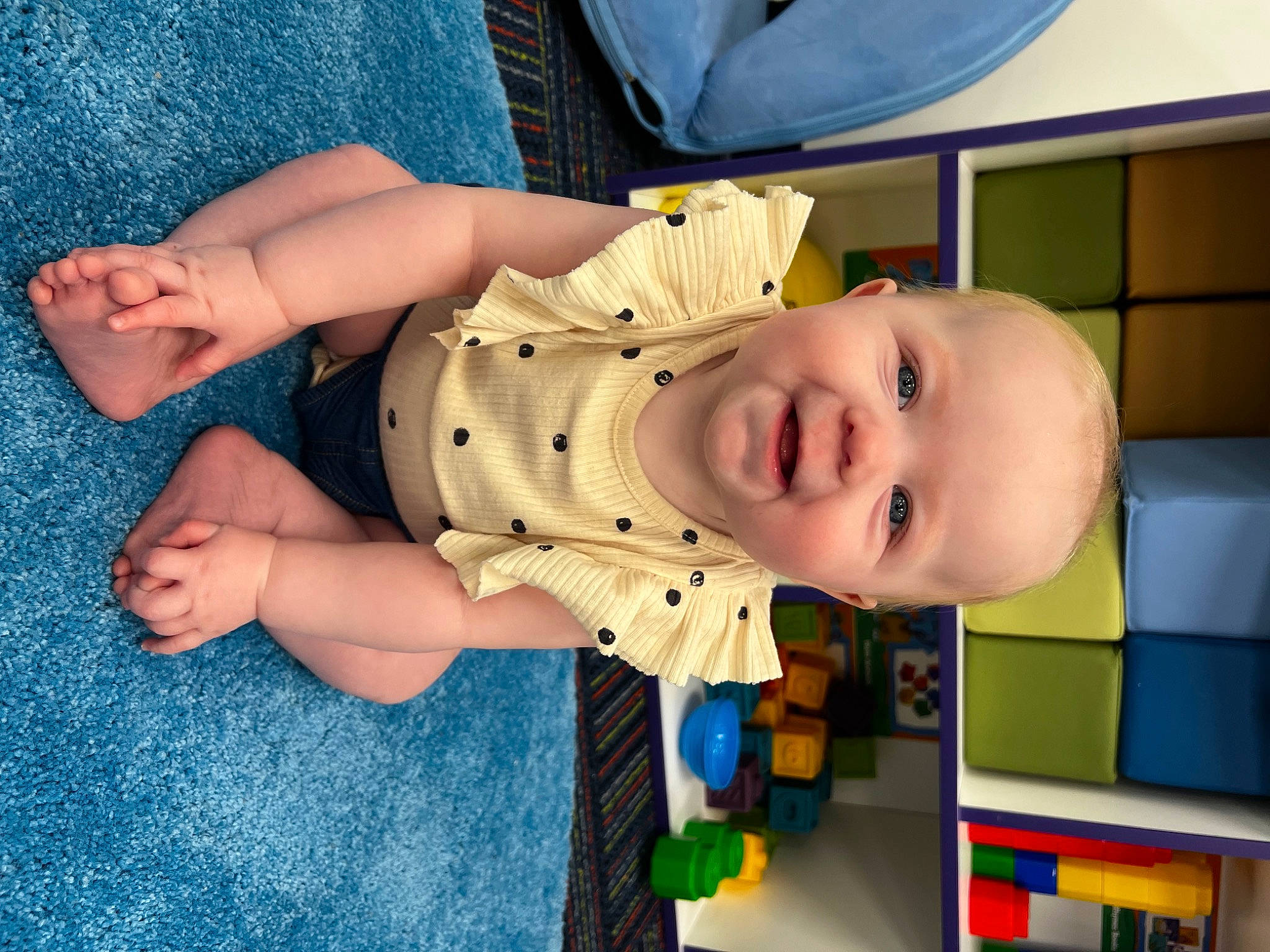 Aileen joined the competition — help win amazing prizes! baby, baby_products, baby_toddler_clothing, blue, cheek, child, comfort, finger, flooring, foot, fun, human_body, human_leg, joy, mouth, nose, person, skin, smile, thigh