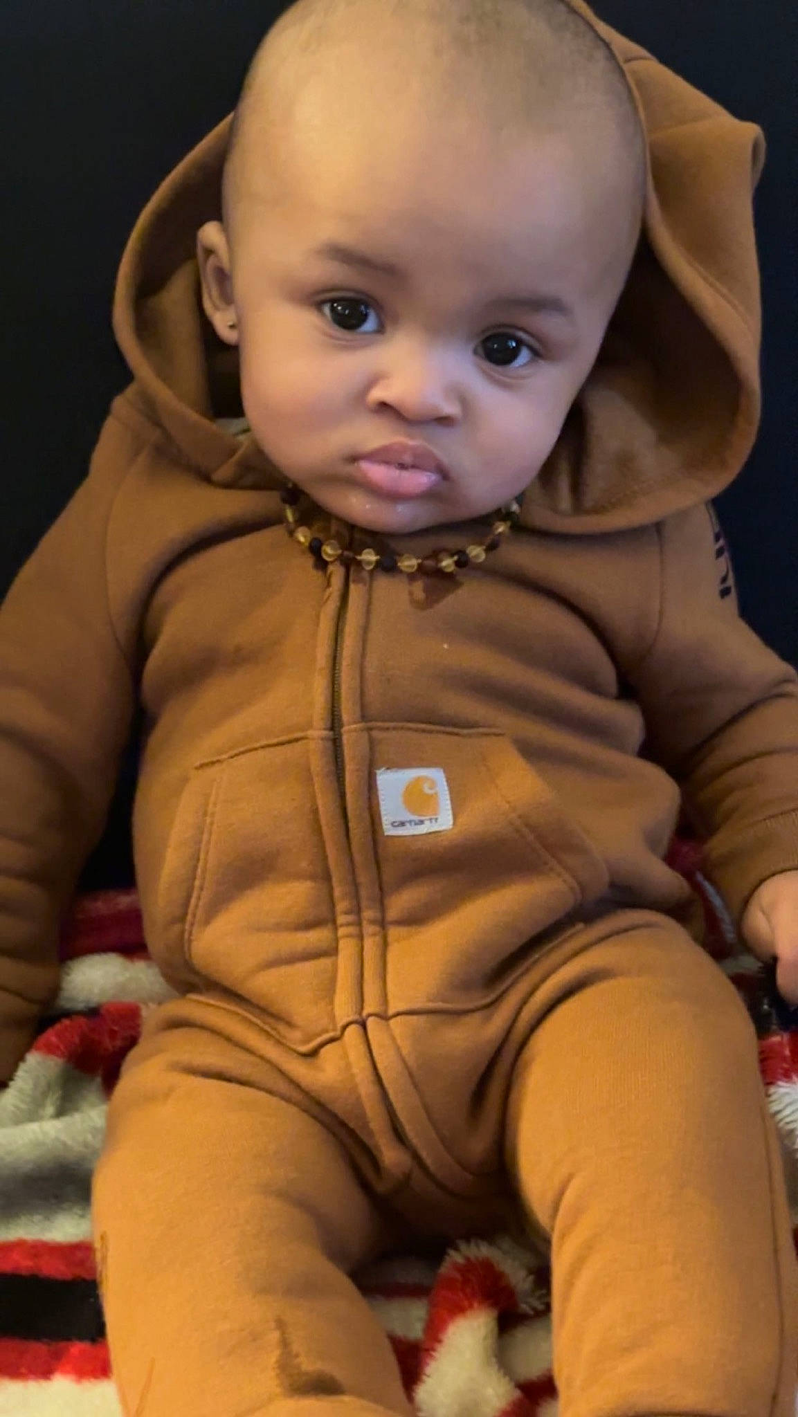 Westen is registered to the contest to win money with this photo: baby, baby_toddler_clothing, cheek, child, comfort, eye, eyebrow, face, finger, head, human_body, iris, lip, mouth, nose, outerwear, person, skin, sleeve, smile