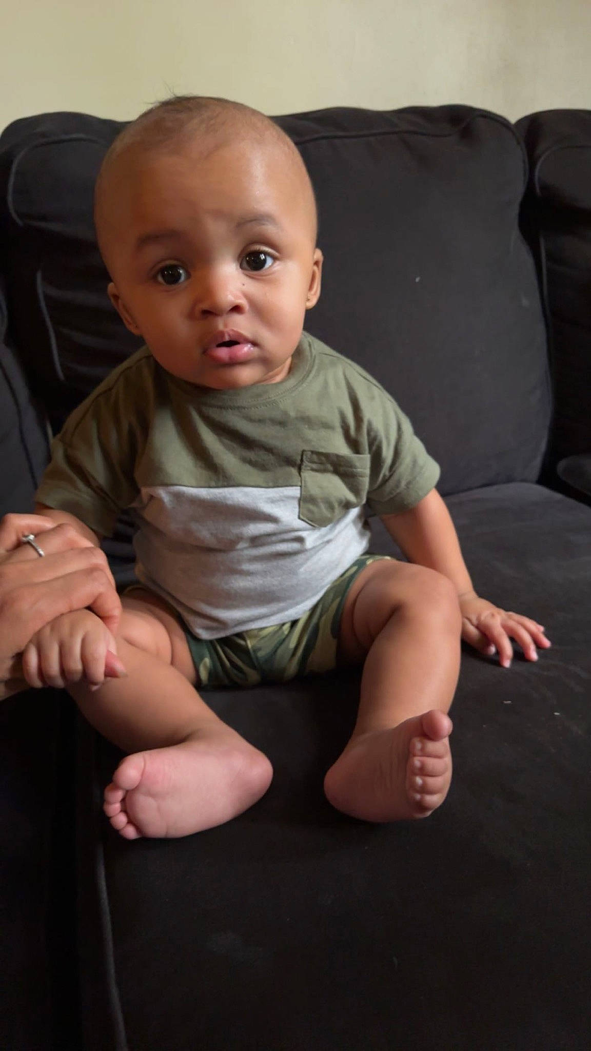 Westen is registered to the contest to win money with this photo: arm, baby, baby_toddler_clothing, barefoot, cheek, comfort, eye, finger, flash_photography, flooring, head, leg, mouth, neck, nose, person, shoulder, skin, sleeve, surprise