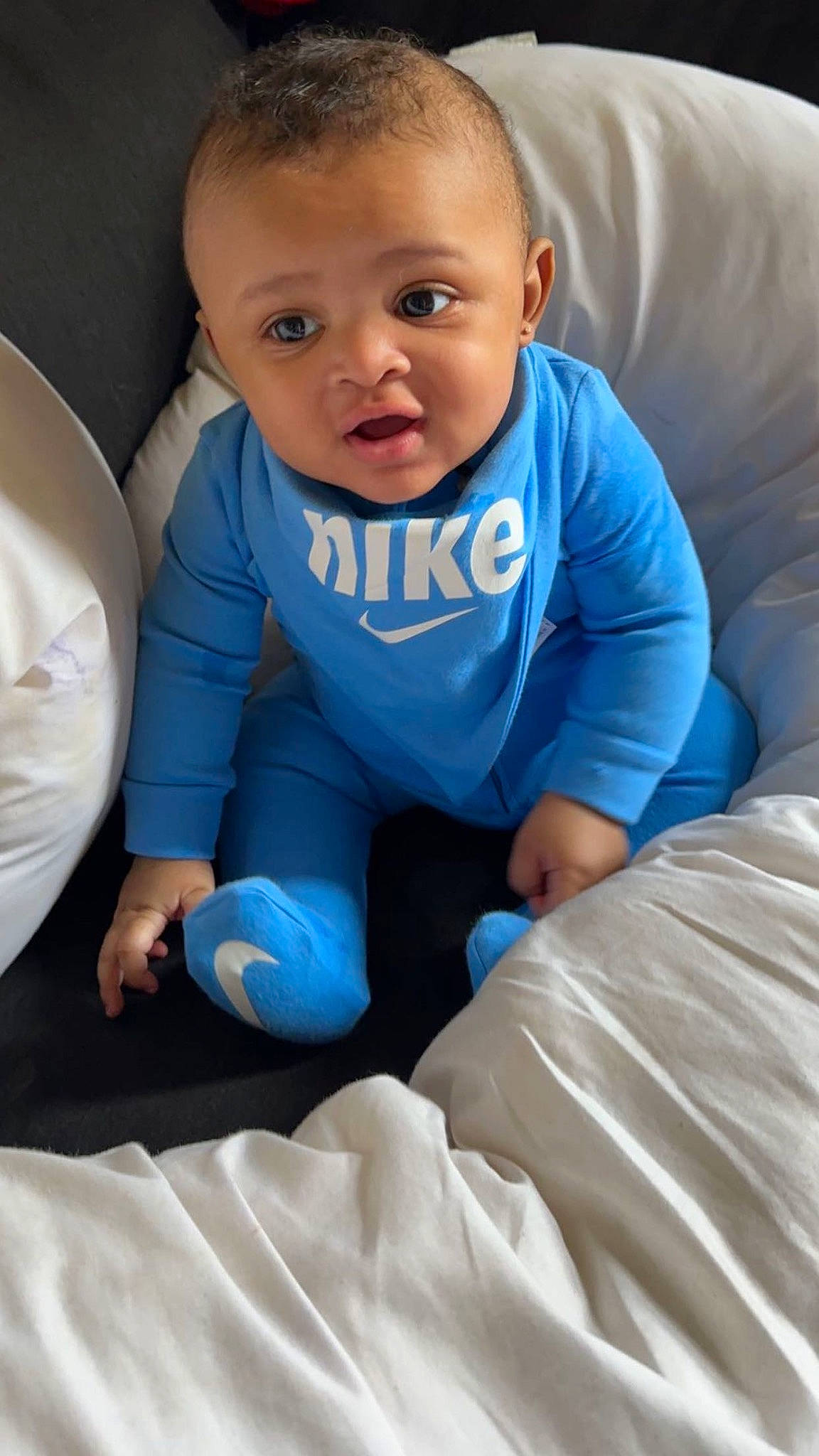William joined the competition — help win amazing prizes! baby, baby_products, baby_toddler_clothing, blue, cheek, child, comfort, elbow, electric_blue, eye, gesture, happy, linens, nose, person, sitting, skin, sleeve, t_shirt, thumb