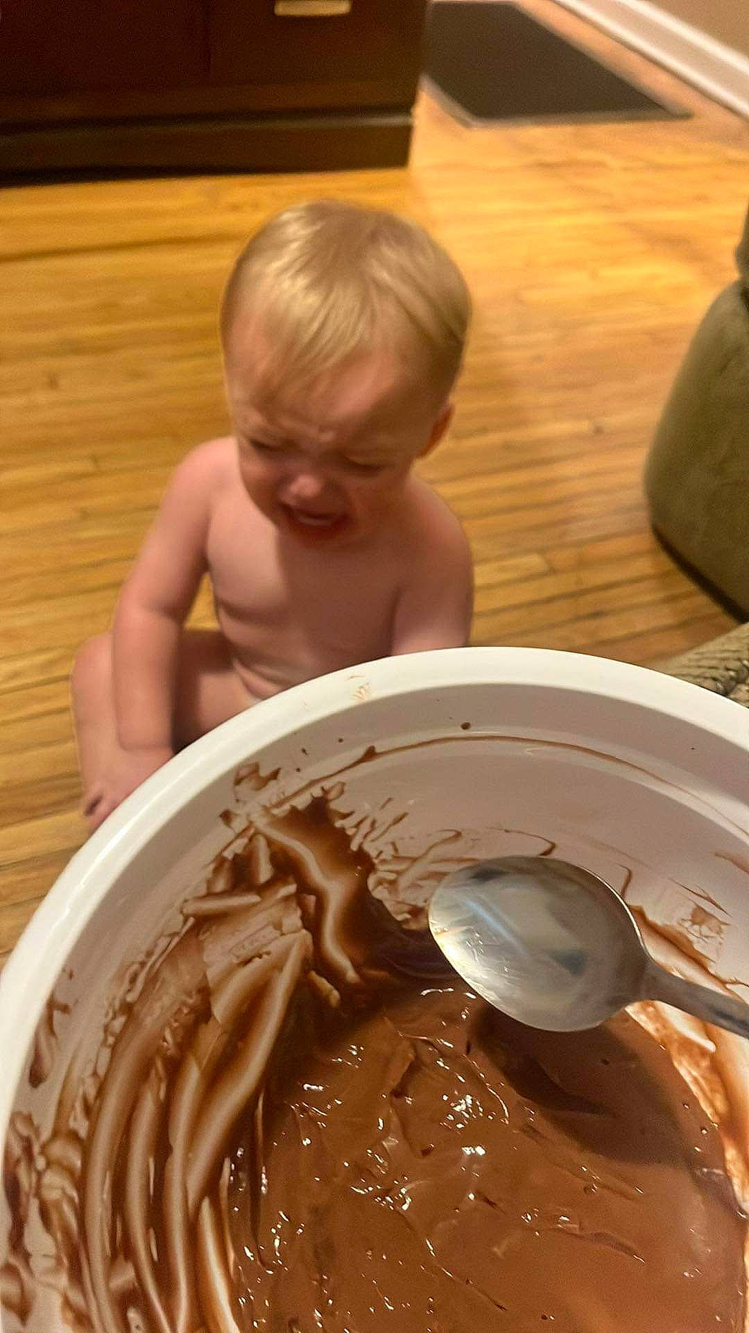 Braylen is registered to the contest to win money with this photo: baked_goods, baking, buttercream, chocolate, chocolate_cake, chocolate_spread, cream, cuisine, dessert, dish, flooring, food, hardwood, icing, ingredient, paste, person, sweetness, tableware, toddler