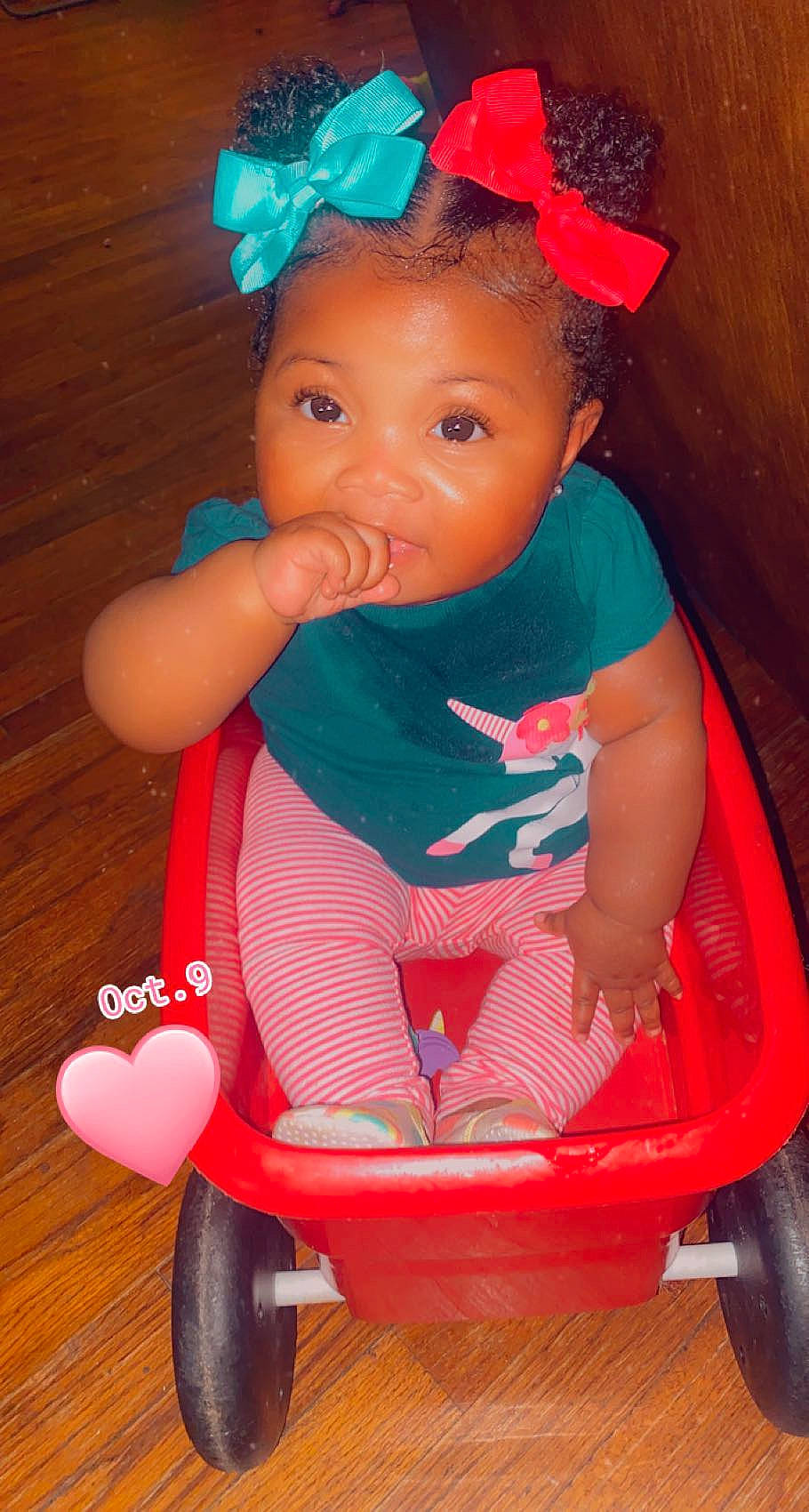 Kyla joined the competition — help win amazing prizes! baby, baby_toddler_clothing, blue, cheek, child, electric_blue, fun, happy, hat, magenta, party_supply, person, photograph, pink, product, red, riding_toy, tire, toddler, wheel