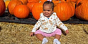 Kalani joined the competition — help win amazing prizes! toddler, child, pumpkins, autumn, outdoor, hay, smiling, baby, fall, nature, seasonal, cute, sitting, daylight, jackets, plants, trees, grass, people, sunny