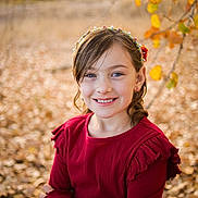 Nevaeh is registered to the contest to win money with this photo: bodypart, child, clothing, face, female, finger, girl, hand, happy, hat, head, leaf, longsleeve, person, photography, plant, portrait, sleeve, smile, tree