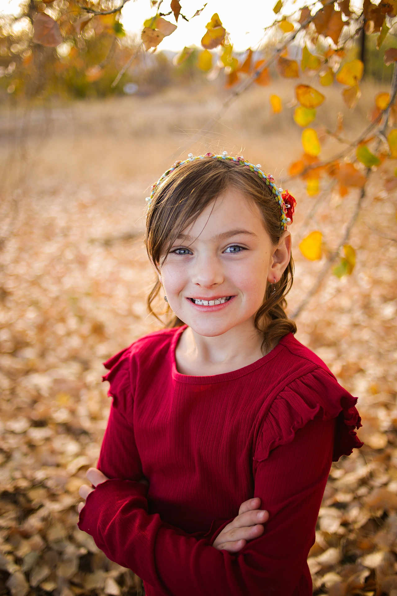 Nevaeh is registered to the contest to win money with this photo: bodypart, child, clothing, face, female, finger, girl, hand, happy, hat, head, leaf, longsleeve, person, photography, plant, portrait, sleeve, smile, tree