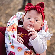 Brynn joined the competition — help win amazing prizes! baby, bodypart, bonnet, cap, clothing, face, finger, frown, hand, hat, head, hoodie, knitwear, newborn, person, photography, portrait, sad, sweater, sweatshirt
