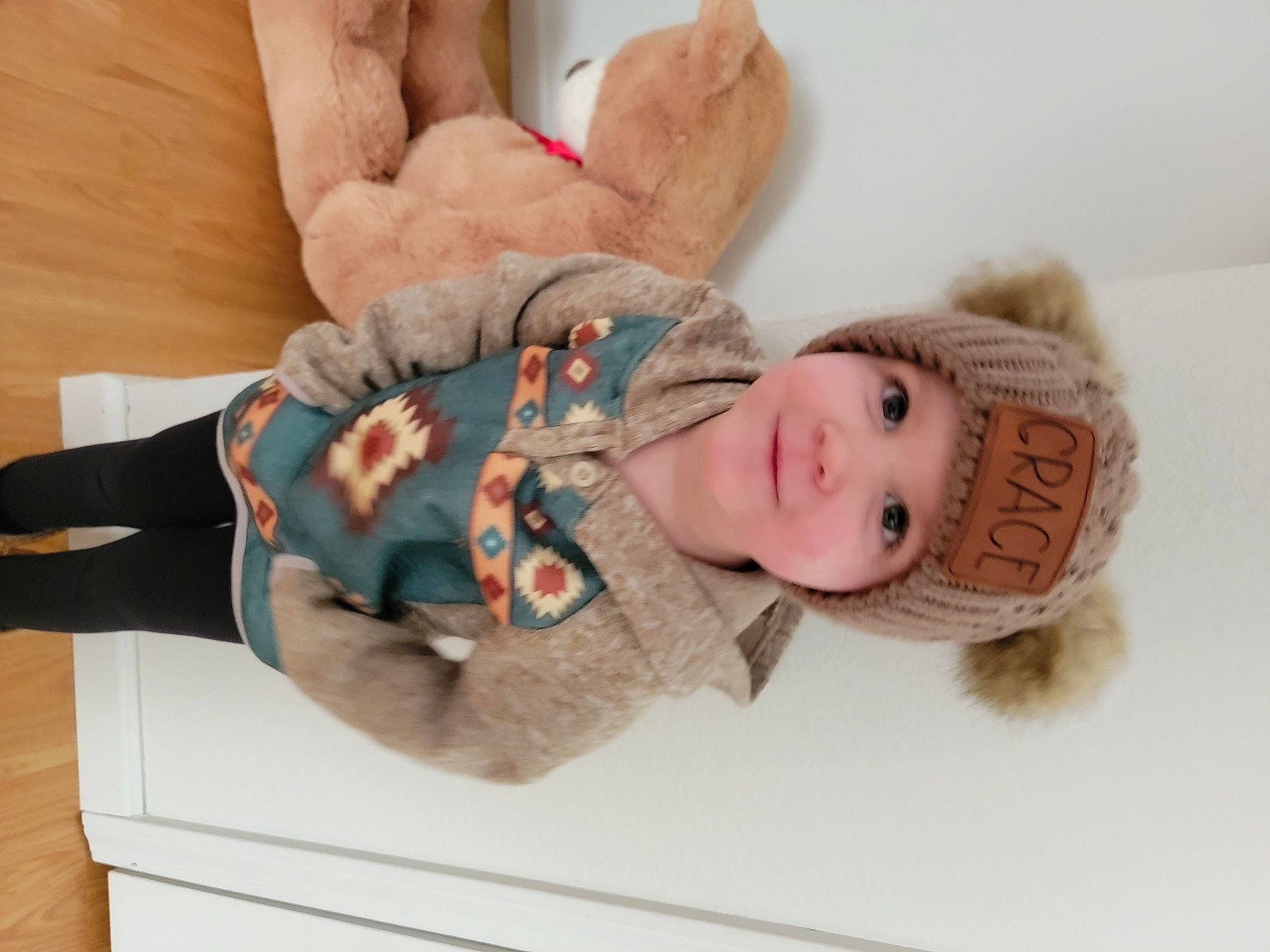 Grace joined the competition — help win amazing prizes! arm, art, baby, baby_products, baby_toddler_clothing, child, comfort, doll, elbow, fashion_accessory, finger, gesture, hand, headgear, headwear, joy, nail, person, stuffed_toy, thumb
