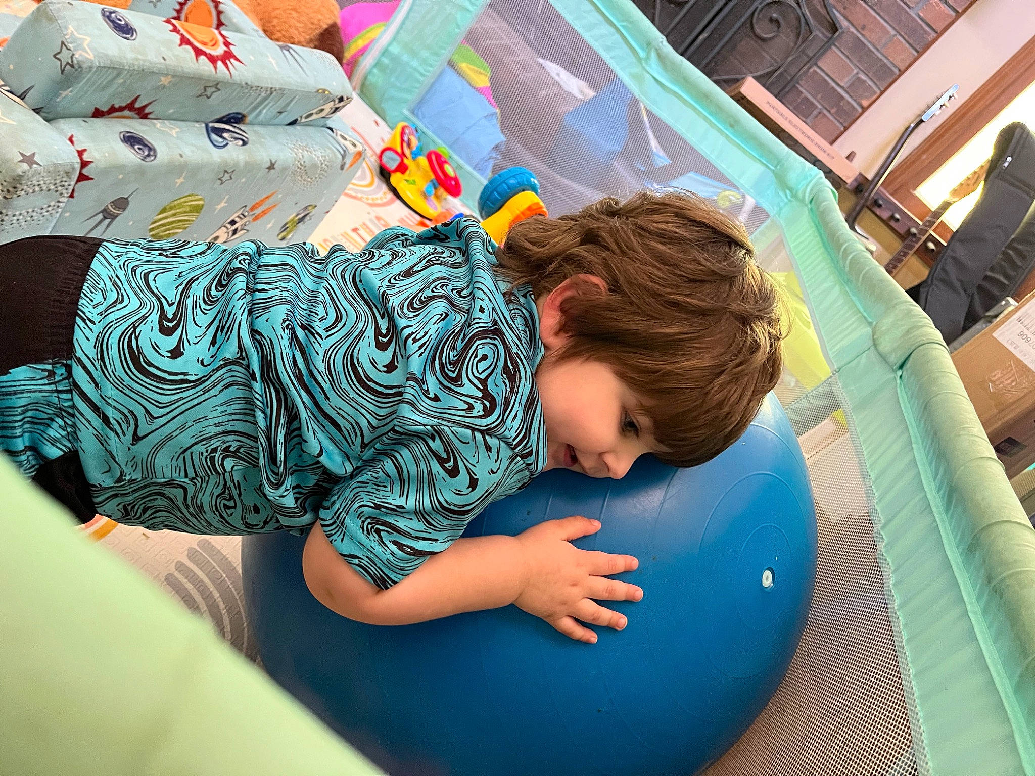 Caden is registered to the contest to win money with this photo: baby, baby_products, baby_toddler_clothing, child, comfort, electric_blue, fun, happy, human_leg, inflatable, leisure, pattern, person, play, recreation, shorts, sitting, t_shirt, thigh, toddler