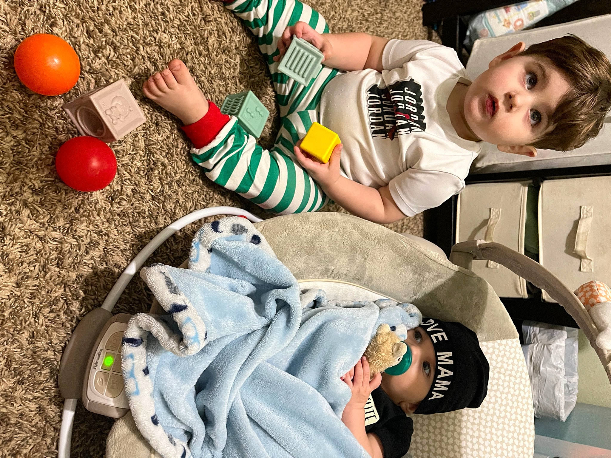 Caden is registered to the contest to win money with this photo: balloon, child, event, eyewear, fun, happy, human, human_leg, leisure, people, person, photograph, recreation, shoe, sitting, snapshot, surprise, t_shirt, thigh, toddler