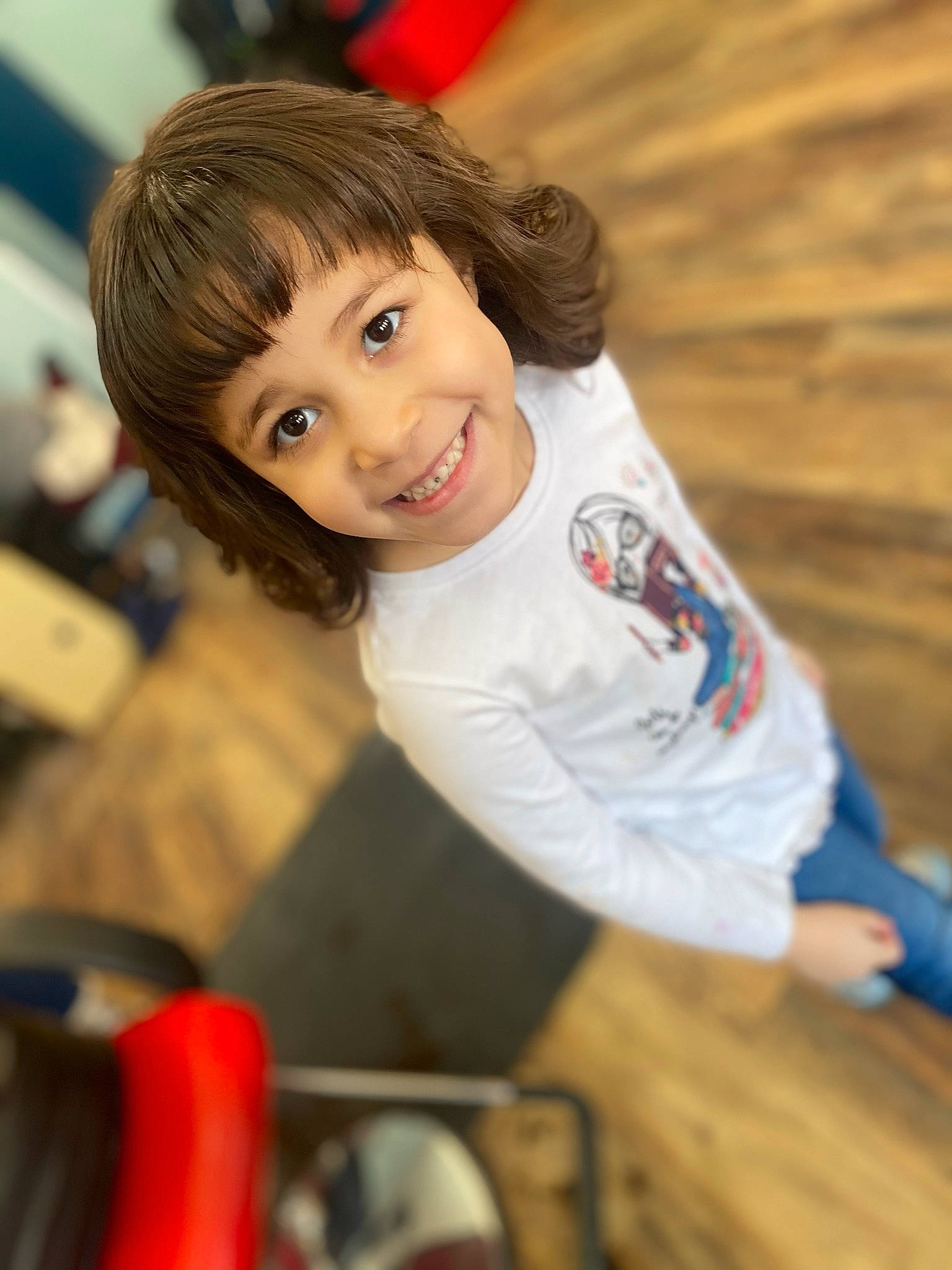 Nalayah joined the competition — help win amazing prizes! brown_hair, child, chin, flooring, fun, hair, happy, human_body, joy, leisure, long_hair, nose, person, recreation, sitting, skin, smile, soil, t_shirt, toddler