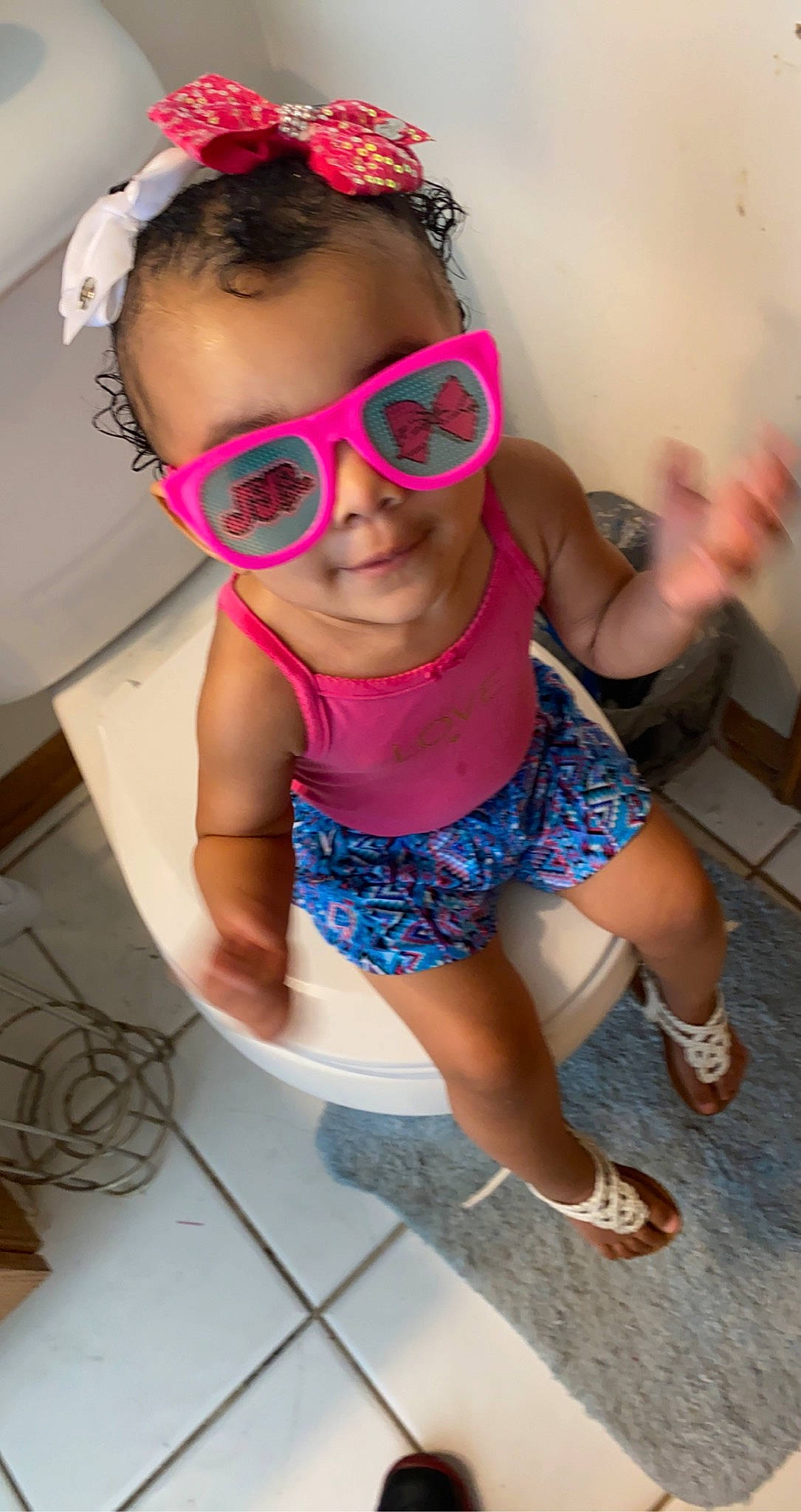 Nylianne joined the competition — help win amazing prizes! child, cool, eyewear, fun, glasses, goggles, head, human_leg, leisure, magenta, person, personal_protective_equipment, pink, sandal, shoe, shorts, sunglasses, swimwear, thigh, vision_care