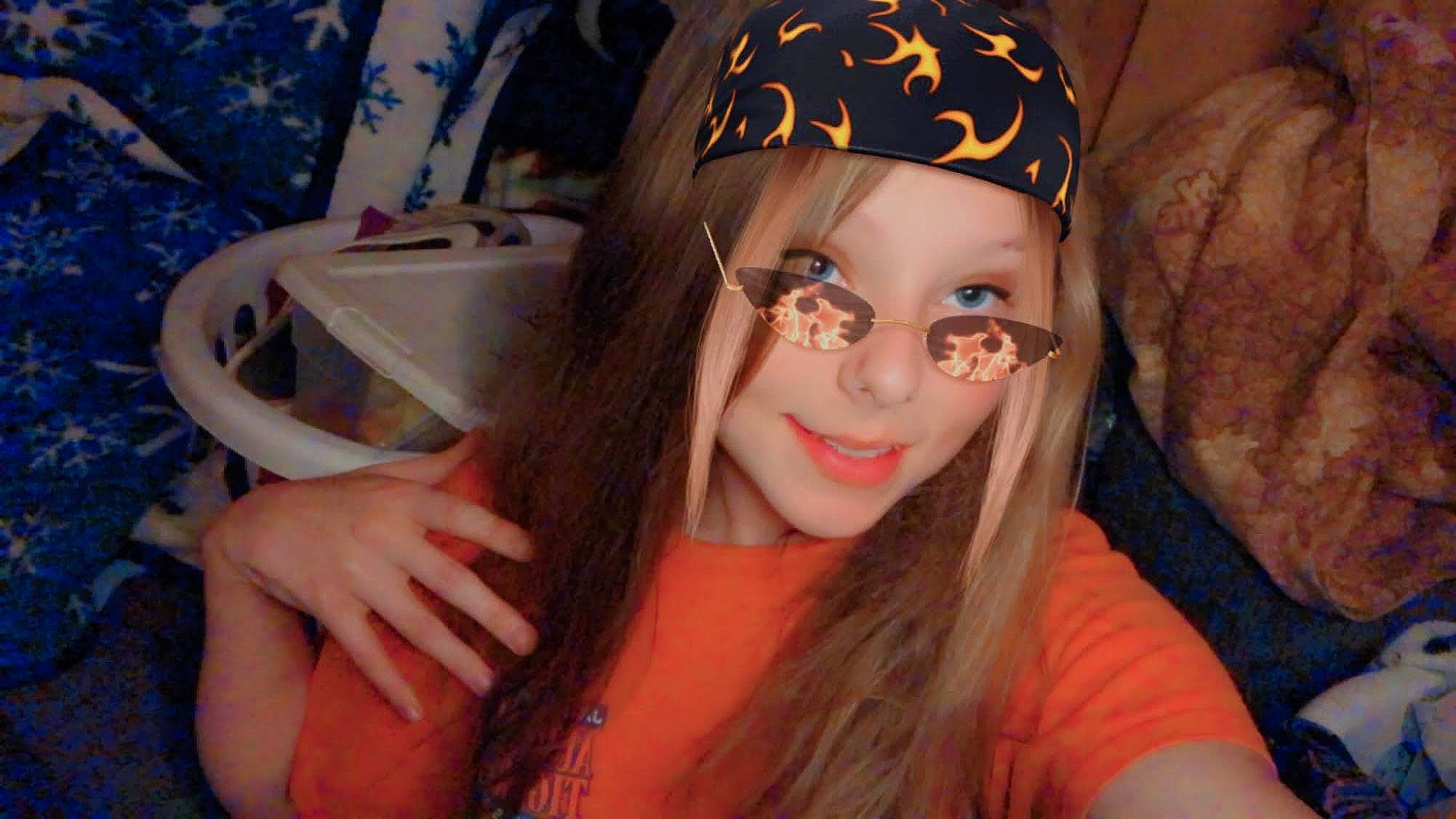 Halie is registered to the contest to win money with this photo: black_hair, cap, eyebrow, eyelash, eyewear, fawn, finger, flash_photography, fun, happy, hat, headgear, headpiece, headwear, iris, lip, long_hair, mouth, neck, person