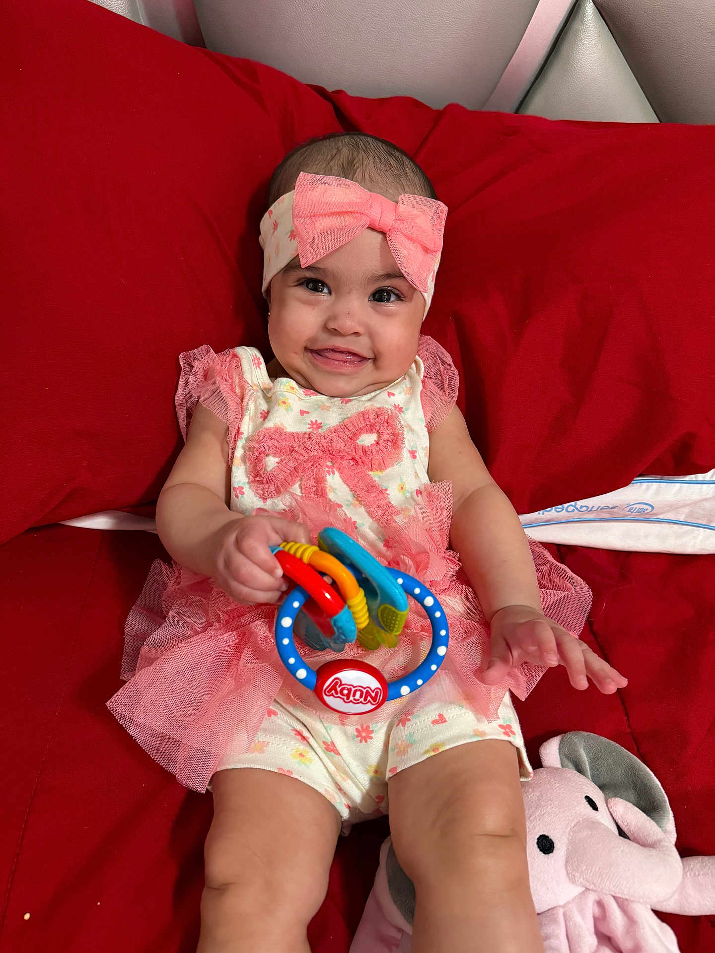 Bellaisabel joined the competition — help win amazing prizes! baby, child, smiling, pink, headband, bow, toy, ring, couch, red, plush, elephant, cute, happy, infant, person, clothing, sitting, indoors, play