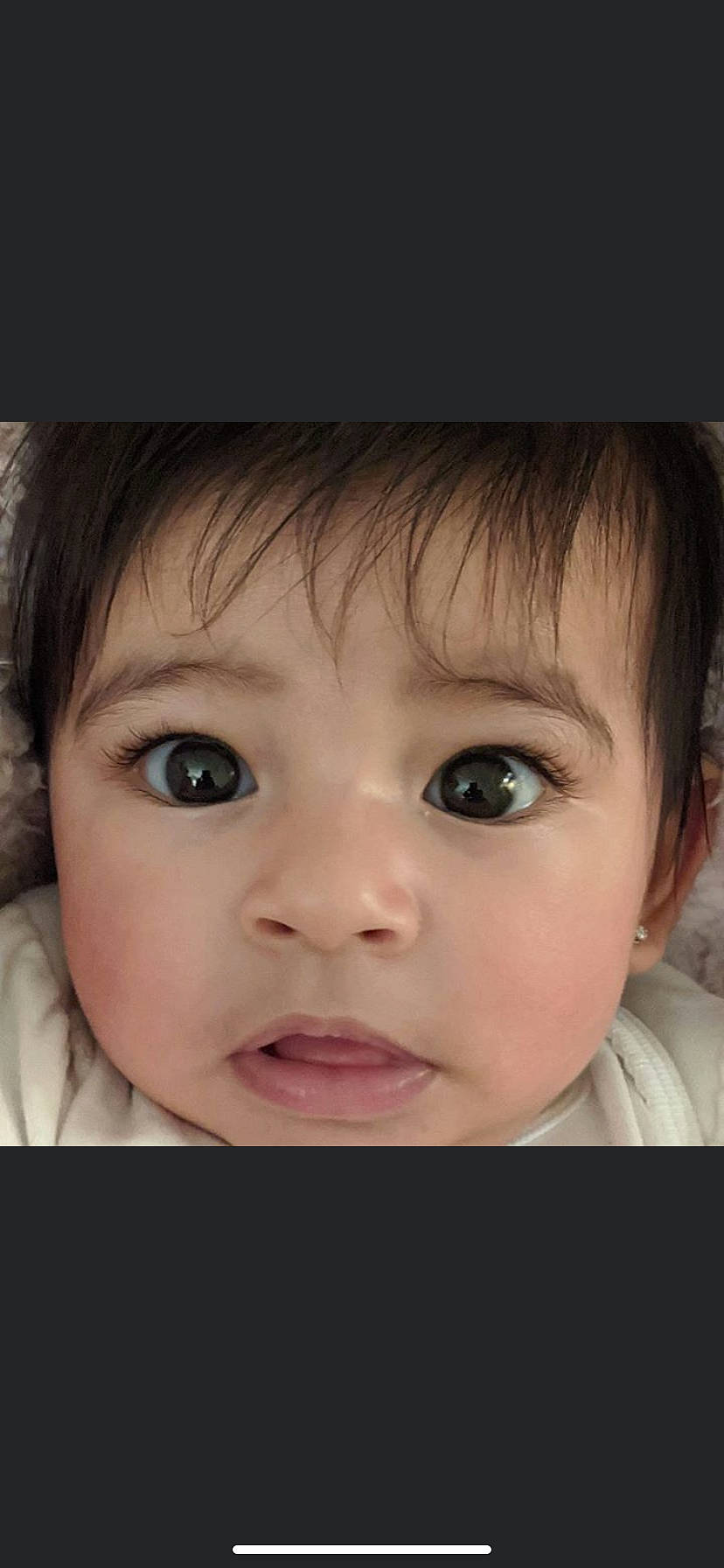 Julia is registered to the contest to win money with this photo: baby, beauty, cheek, child, chin, close_up, eye, eyebrow, eyelash, face, facial_expression, forehead, hair, head, iris, lip, nose, organ, person, skin