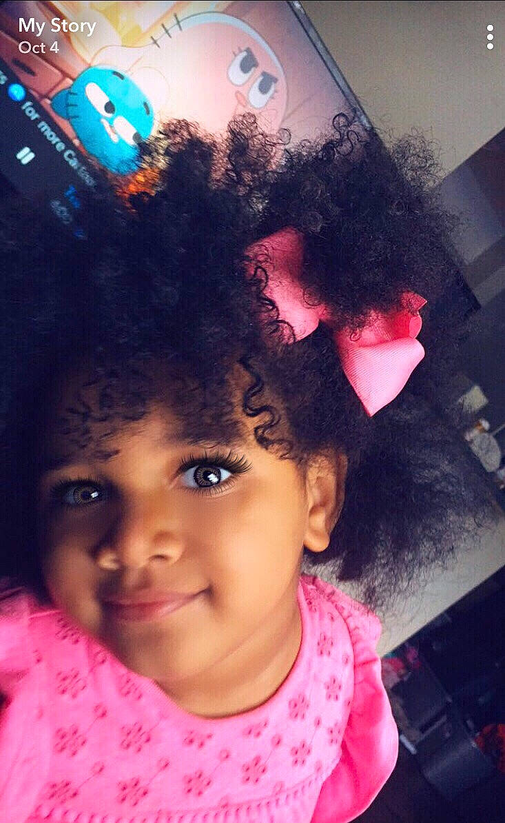 Taylor Nicole is registered to the contest to win money with this photo: afro, black_hair, cheek, child, chin, eye, eyebrow, face, forehead, hair, hairstyle, head, human_hair_color, joy, lip, nose, person, pink, purple, selfie