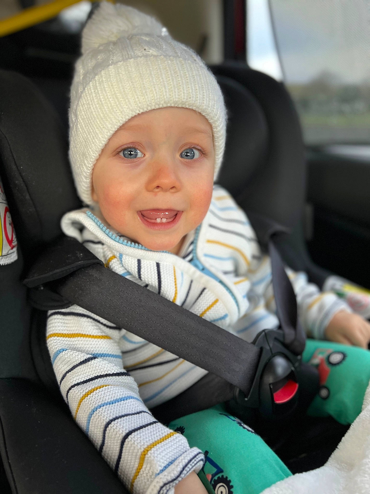 Devon is registered to the contest to win money with this photo: auto_part, automotive_design, baby, baby_carriage, baby_in_car_seat, baby_products, cap, car_seat, car_seat_cover, child, comfort, electric_blue, family_car, happy, head_restraint, headwear, joy, motor_vehicle, person, seat_belt