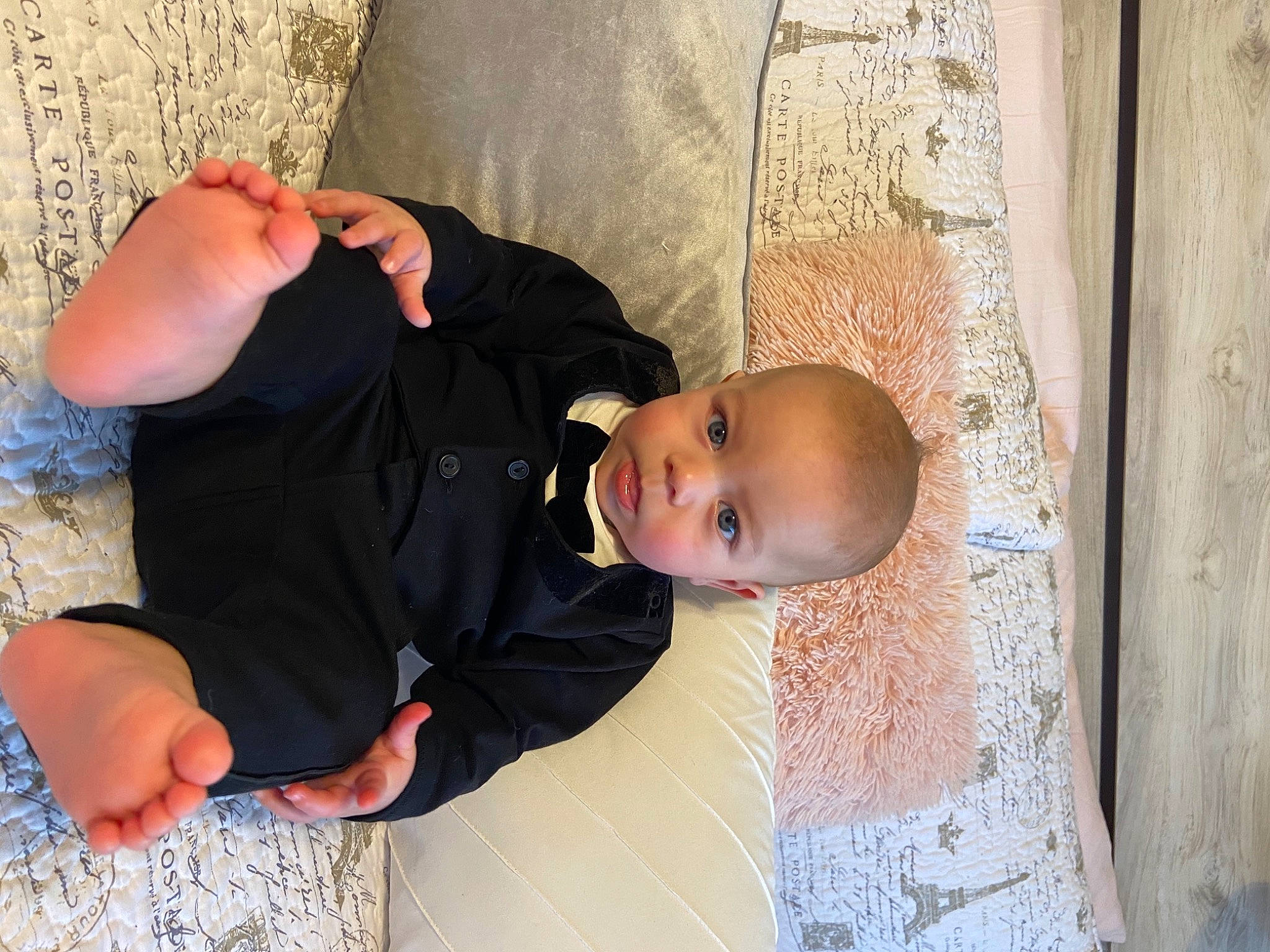 Kallum is registered to the contest to win money with this photo: baby, baby_toddler_clothing, child, comfort, dress, finger, flooring, fun, gesture, happy, human_body, joint, leg, linens, person, skin, smile, textile, toddler, tree