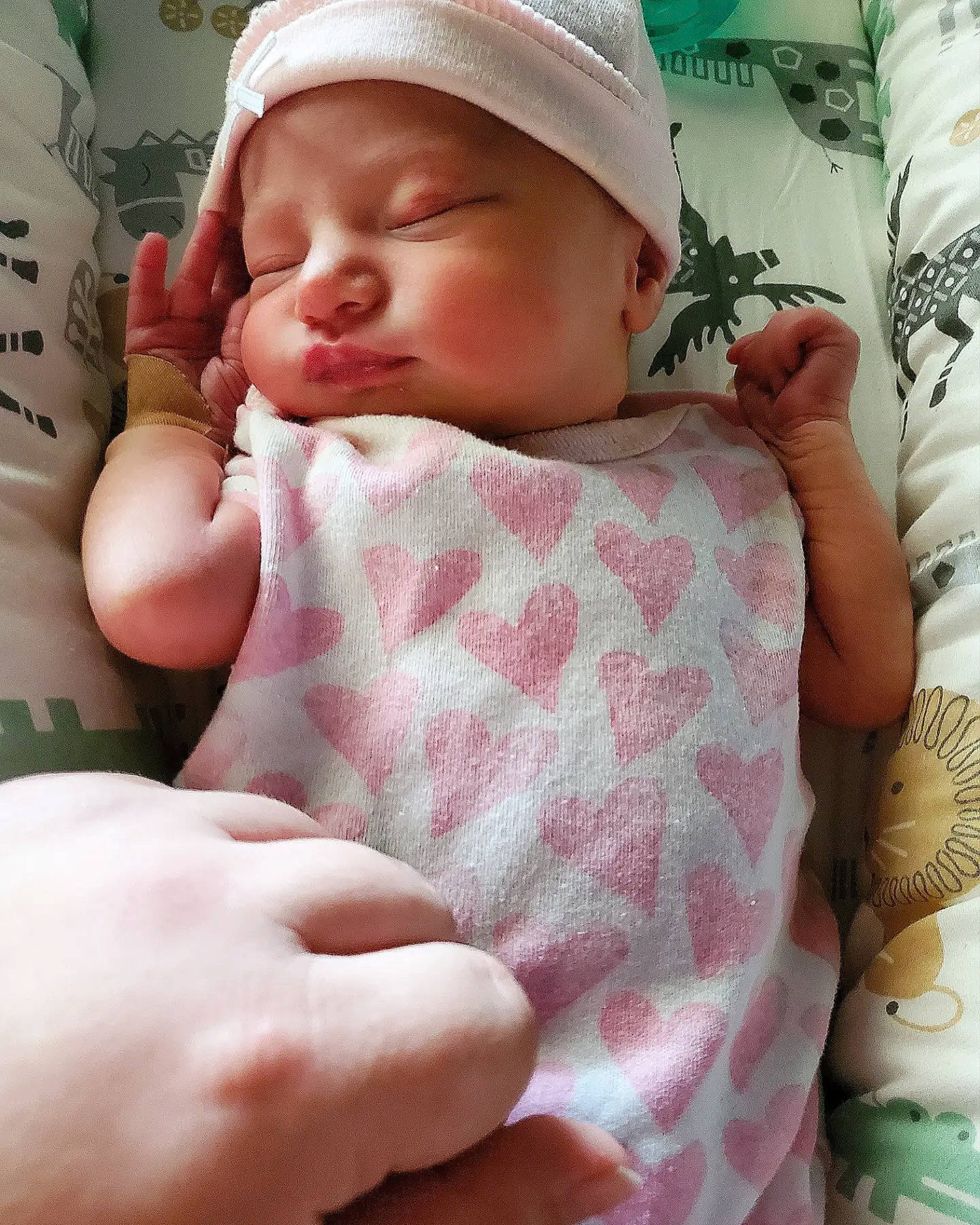 Elena is registered to the contest to win money with this photo: baby, baby_sleeping, baby_toddler_clothing, cap, cheek, comfort, eyelash, face, finger, gesture, hand, lip, mouth, neck, nose, person, pink, skin, sleeve, textile