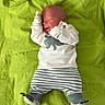 Paxtyn joined the competition — help win amazing prizes! baby, newborn, sleeping, infant, blanket, green, clothing, sweater, striped_pants, mittens, footwear, cozy, cute, soft, lying_down, indoor, portrait, child, peaceful, smile