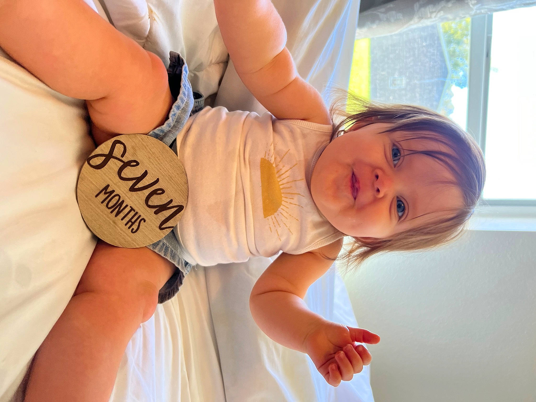 Iyla is registered to the contest to win money with this photo: arm, baby_toddler_clothing, chest, comfort, dress, elbow, facial_expression, fun, gesture, glasses, happy, joint, knee, person, skin, smile, stomach, thigh, toddler, trunk