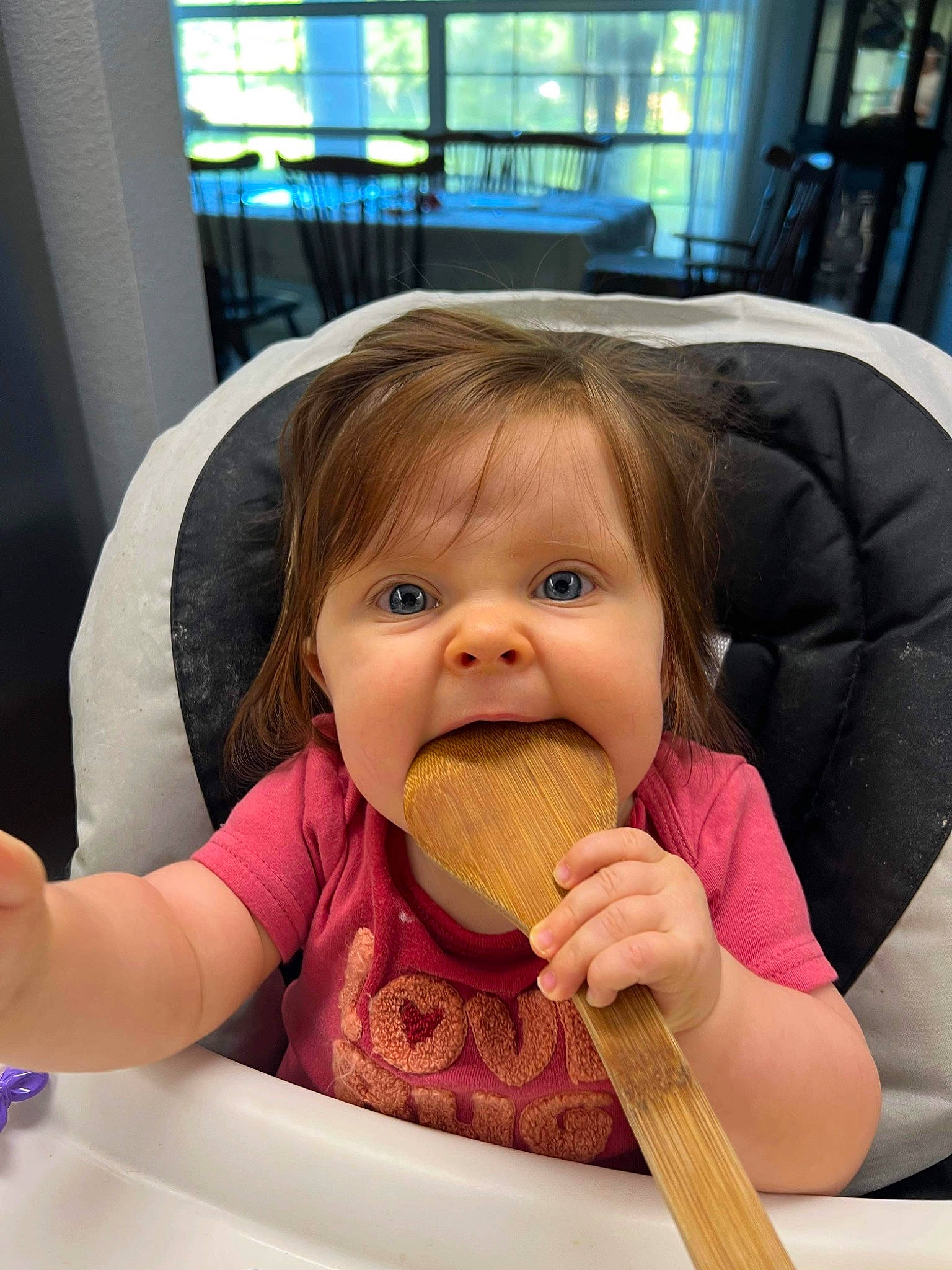 Iyla is registered to the contest to win money with this photo: baby, baby_toddler_clothing, biting, chair, cheek, child, comfort, eyelash, finger, food, food_craving, gesture, happy, lip, mouth, nose, person, skin, snapshot, tableware