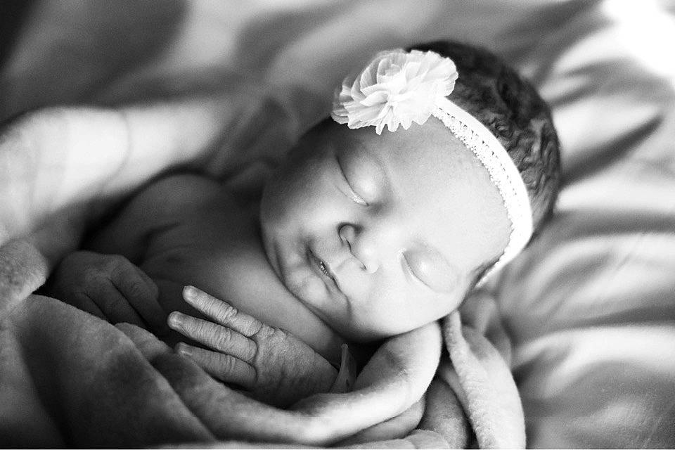 Ryver is registered to the contest to win money with this photo: baby, black_and_white, child, comfort, eye, eyebrow, eyelash, face, finger, flash_photography, gesture, hand, happy, head, headgear, iris, lip, monochrome_photography, person, skin