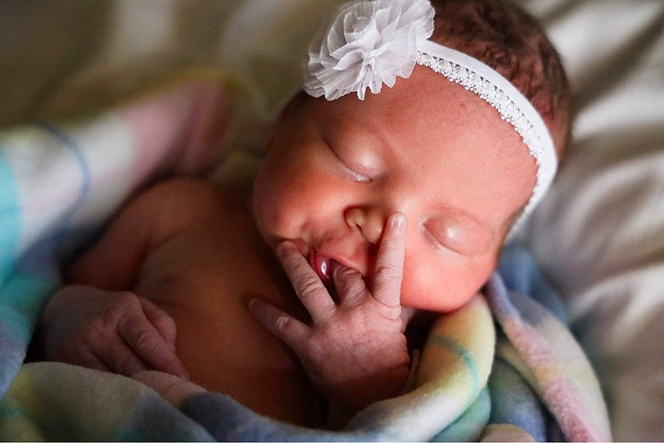 Ryver is registered to the contest to win money with this photo: baby, baby_toddler_clothing, bedtime, cheek, child, close_up, comfort, event, eye, finger, gesture, happy, mouth, nail, nose, person, portrait_photography, room, skin, thumb