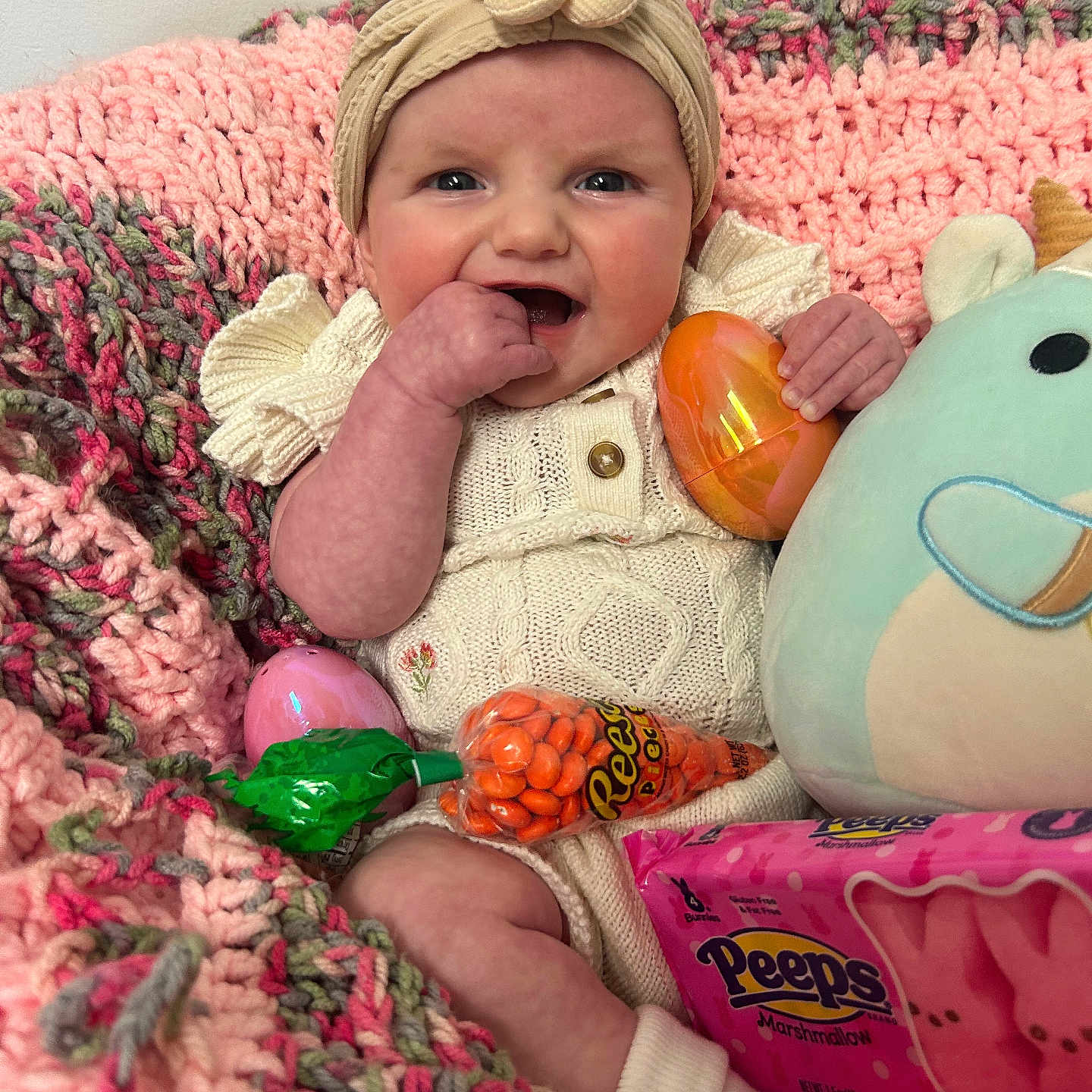Ellie-Mae joined the competition — help win amazing prizes! baby, bodypart, candy, cap, clothing, couch, face, finger, food, furniture, hand, hat, head, homedecor, person, photography, portrait, quilt, sweets, toy