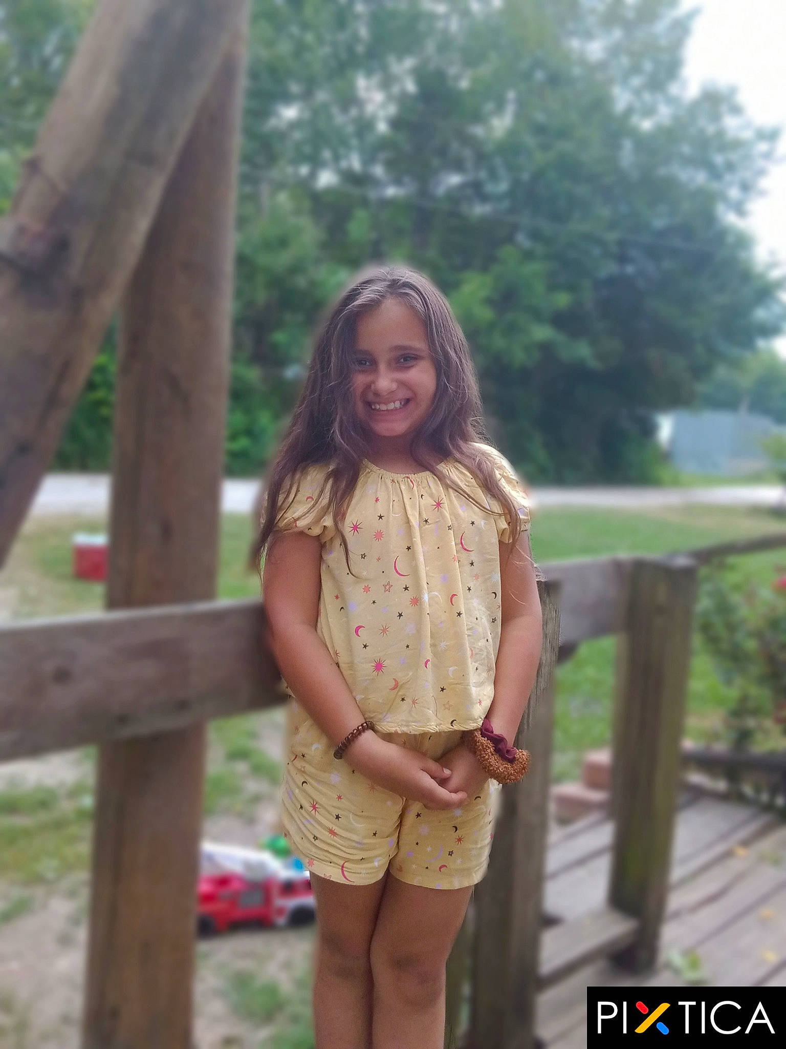 Rose is registered to the contest to win money with this photo: blond, brown_hair, fawn, fence, grass, hairstyle, happy, joy, leg, leisure, long_hair, person, plant, skin, sleeve, smile, summer, thigh, tree, trunk