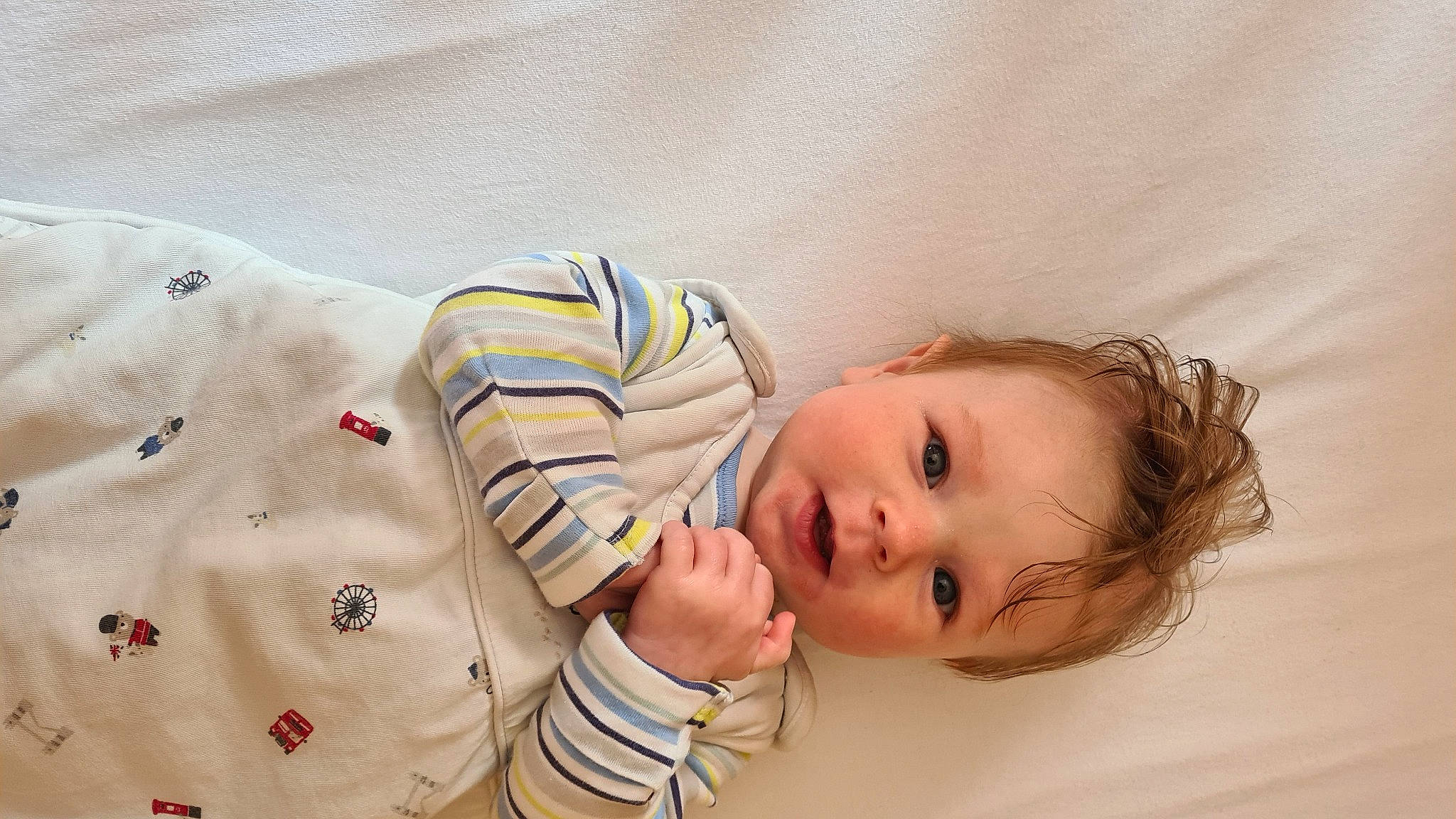 Caleb is registered to the contest to win money with this photo: baby, baby_sleeping, baby_toddler_clothing, bedtime, cheek, child, comfort, gesture, happy, linens, person, portrait_photography, room, skin, sleeve, smile, toddler, wood