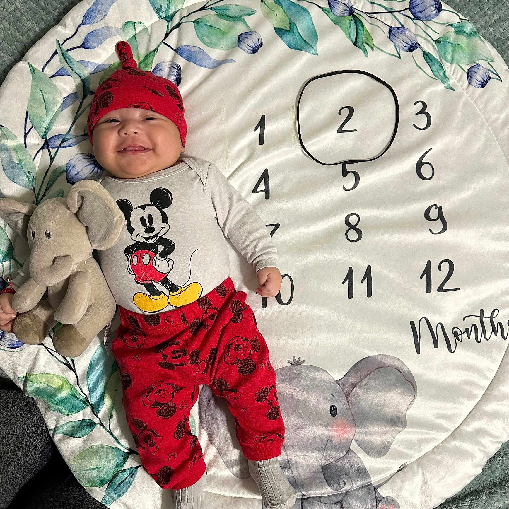 Javier joined the competition — help win amazing prizes! baby, blanket, cap, clothing, face, furniture, hat, head, hosiery, number, pajamas, pants, person, photography, portrait, quilt, sitting, sock, symbol, text