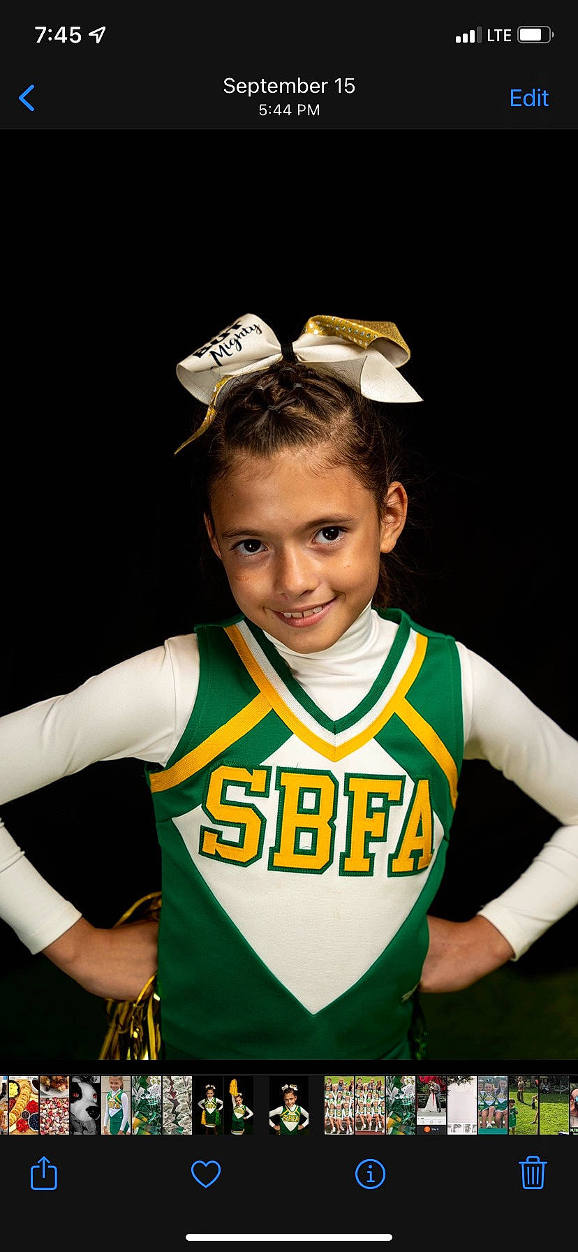 Skylar is registered to the contest to win money with this photo: arm, ball_game, beauty, championship, cheerleading_uniform, competition_event, gesture, hair, jersey, joy, person, player, sleeve, smile, sports, sports_jersey, sports_uniform, sportswear, t_shirt, team_sport