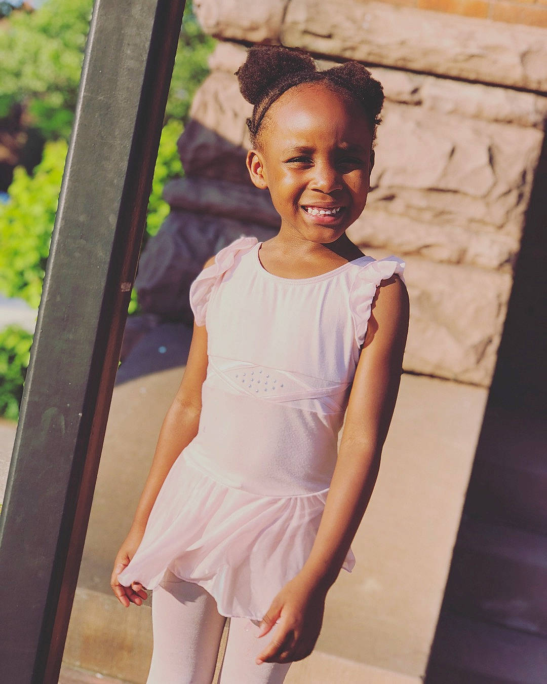 Kailia is registered to the contest to win money with this photo: abdomen, child, child_model, cocktail_dress, dress, girl, gown, hair_accessory, joint, joy, neck, pattern, person, photo_shoot, pink, shoulder, sleeve, smile, standing, textile