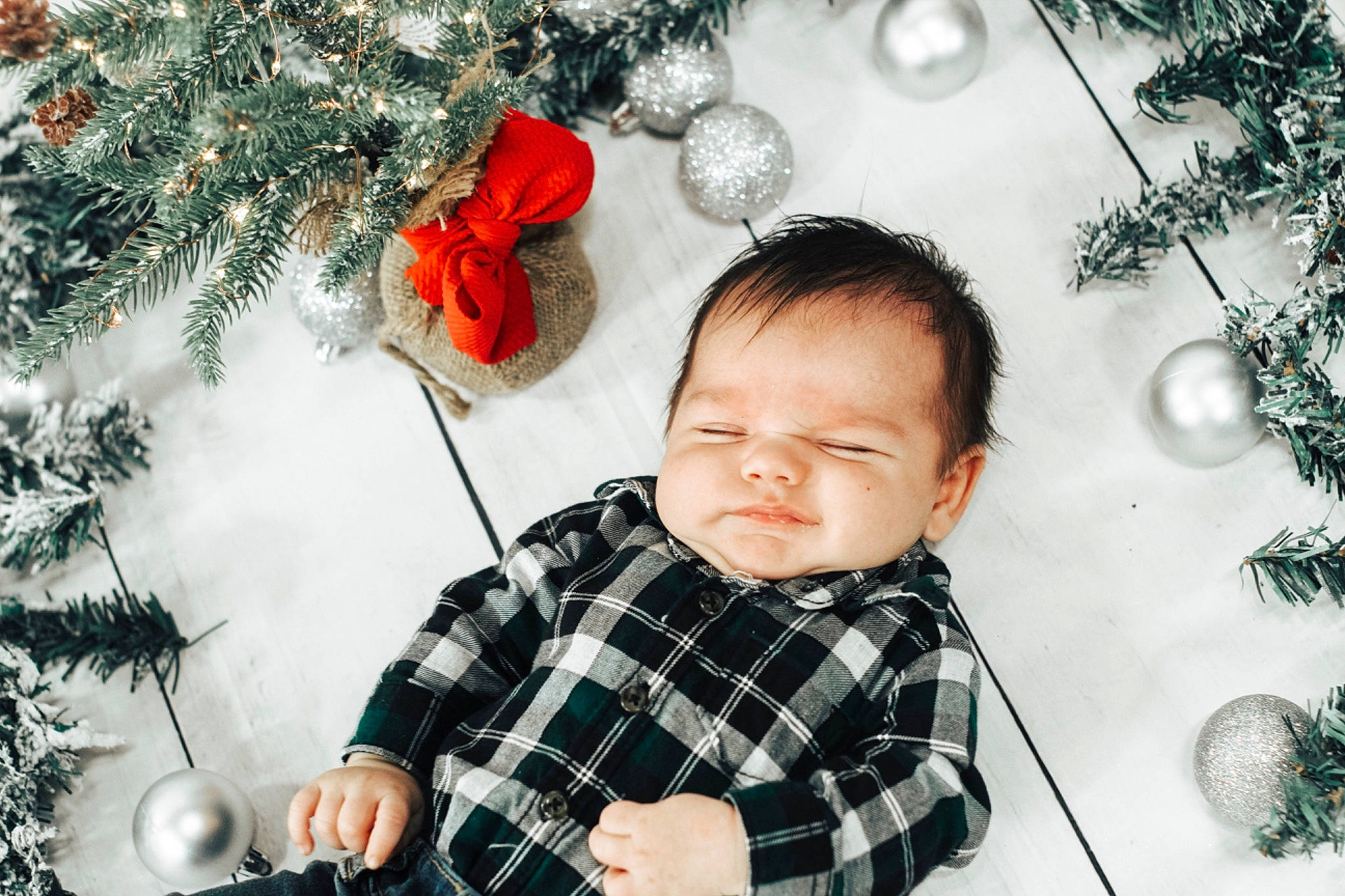 Parker is registered to the contest to win money with this photo: baby, child, christmas, christmas_decoration, christmas_eve, christmas_ornament, christmas_tree, conifer, fir, happy, holiday, interior_design, person, photography, pine_family, plaid, plant, smile, toddler, tree