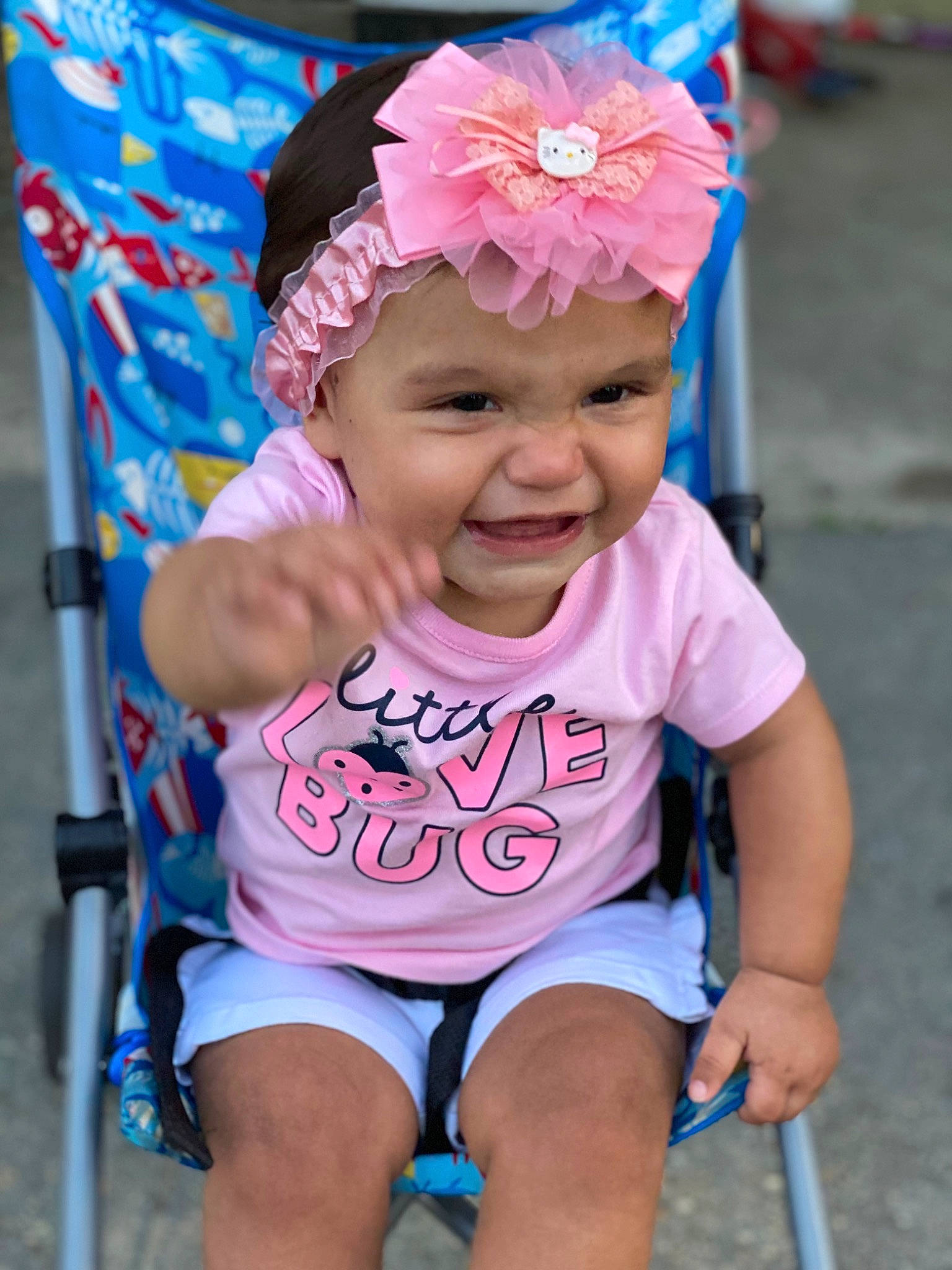 Gianna is registered to the contest to win money with this photo: baby_toddler_clothing, blue, eye, facial_expression, flower, fun, happy, headgear, headwear, leisure, magenta, organ, people, person, photograph, pink, smile, summer, thigh, toddler
