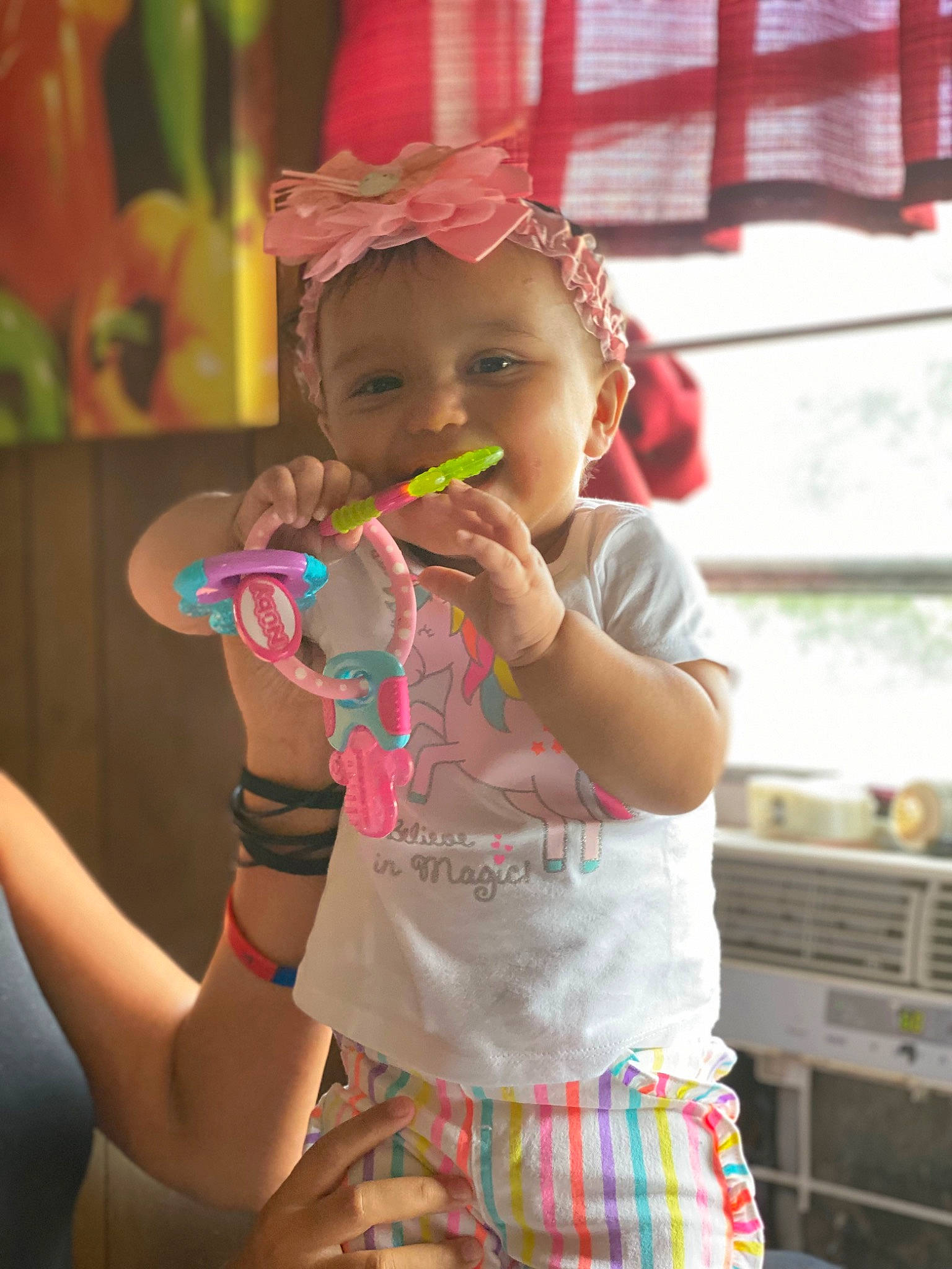 Gianna joined the competition — help win amazing prizes! baby, baby_toddler_clothing, baseball_cap, cap, child, event, finger, fun, gesture, green, hand, happy, hat, headwear, leisure, person, pink, skin, smile, sun_hat
