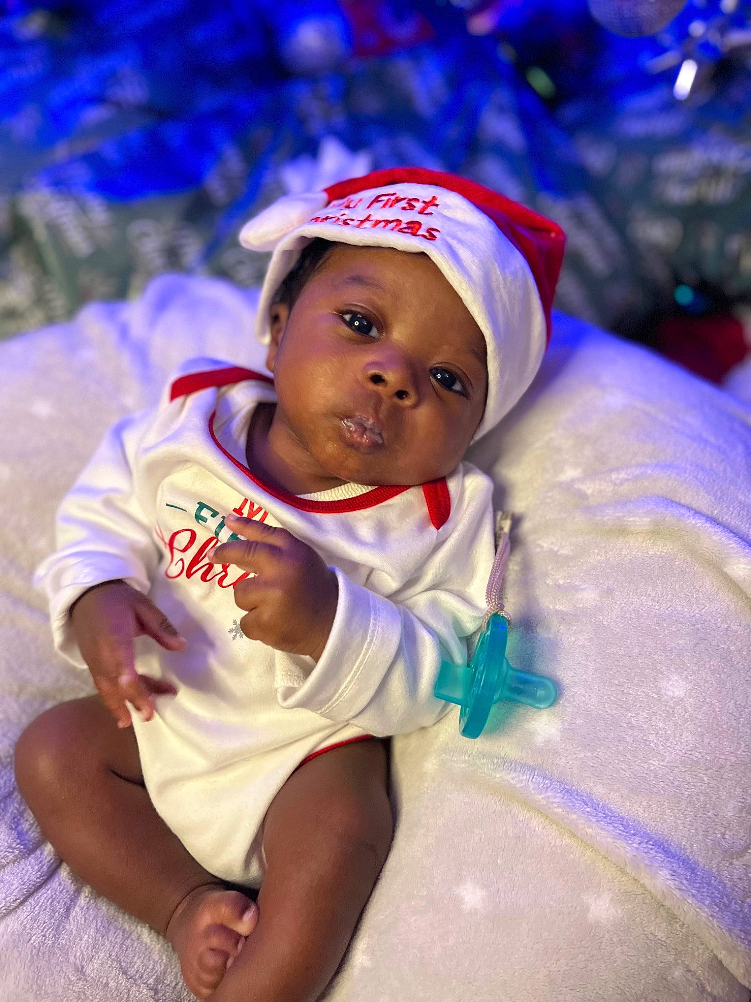 Cortez is registered to the contest to win money with this photo: baby, baseball_cap, cap, child, christmas, christmas_eve, electric_blue, event, fun, happy, headwear, holiday, leisure, magenta, person, pink, plant, purple, recreation, t_shirt