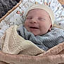 Théo participe au concours pour gagner de l'argent avec cette photo : baby, newborn, blanket, hat, smile, sleeping, cozy, swaddle, infant, soft, plush, cute, child, face, wrapped, pattern, animal_print, headwear, comfort, resting