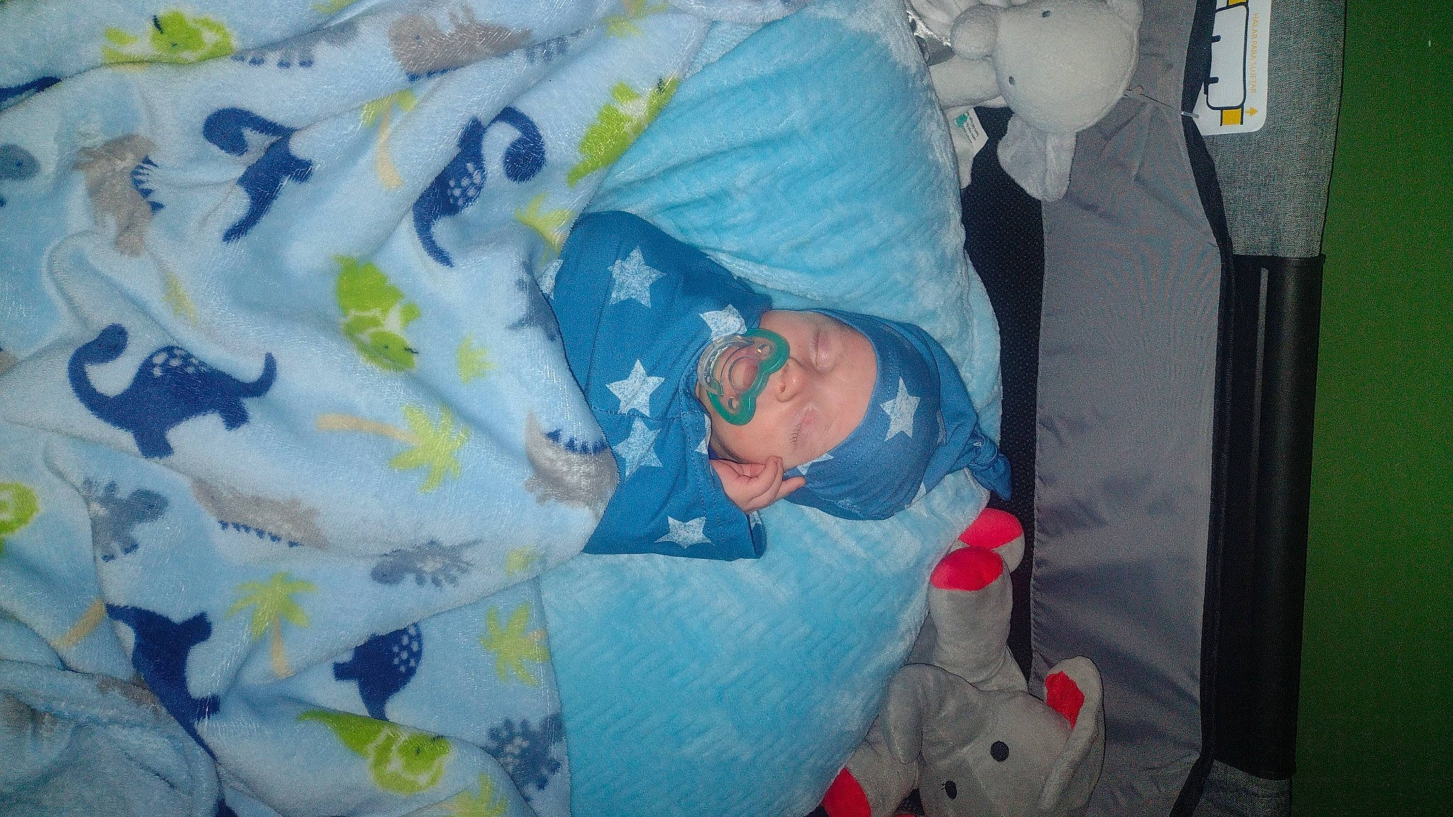 Wyatt is registered to the contest to win money with this photo: baby, baby_products, baby_toddler_clothing, bag, carmine, child, comfort, design, electric_blue, headwear, linens, pattern, person, plastic, product, room, sleeve, space, t_shirt, textile